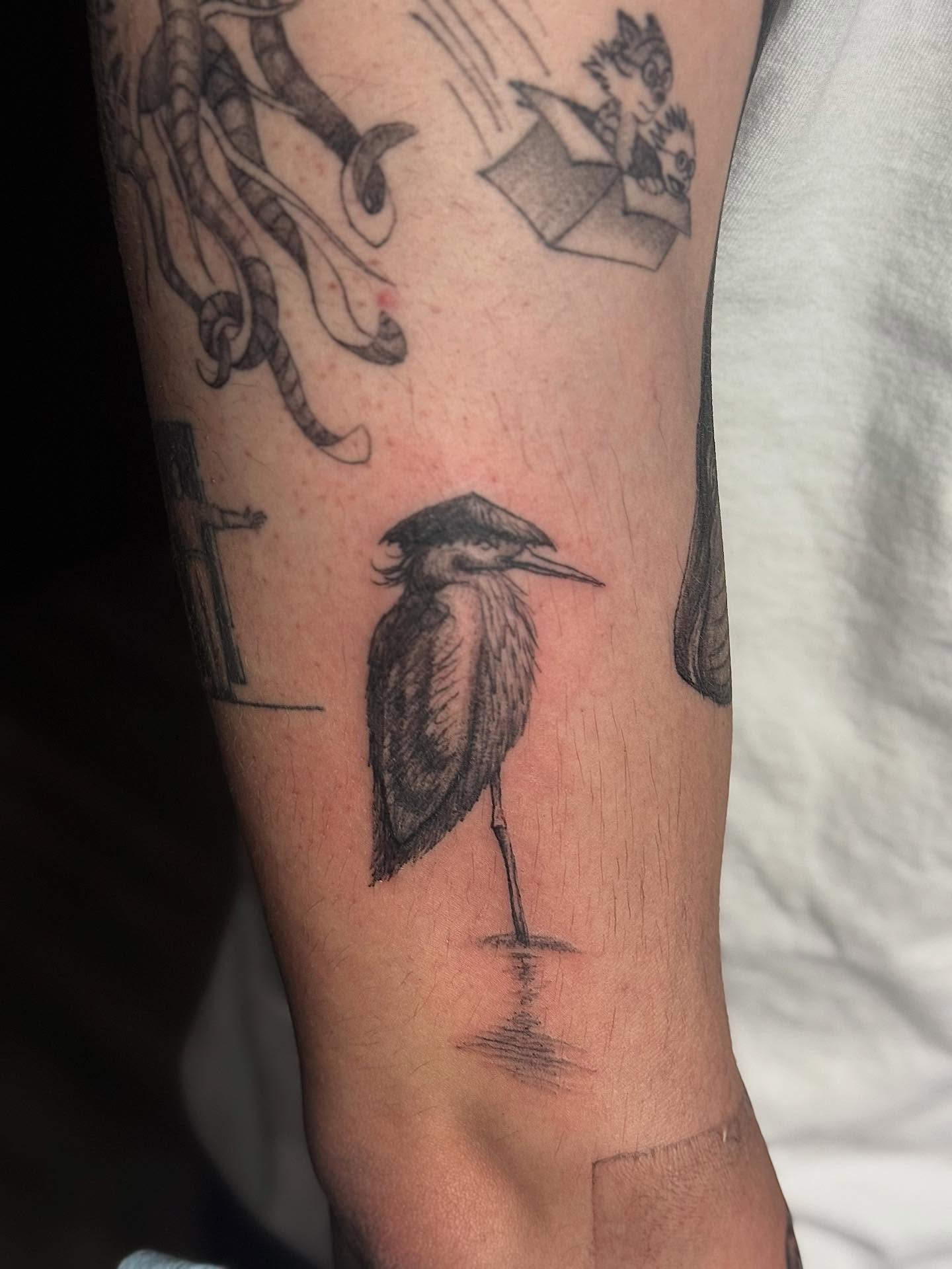 Heron black and grey tattoo on the forearm by Khang🇻🇳