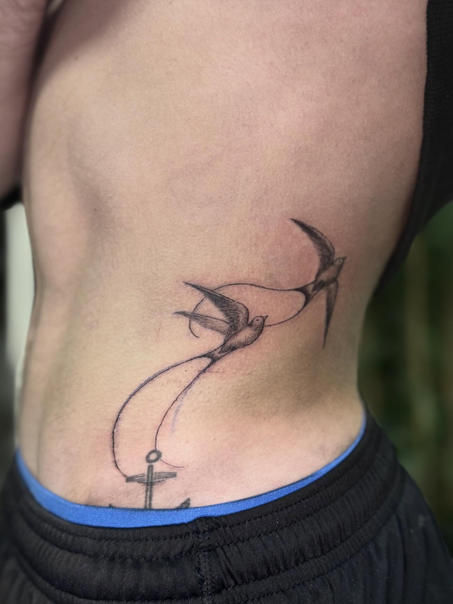 Swallows and anchor black and grey tattoo on the ribs by Khang🇻🇳