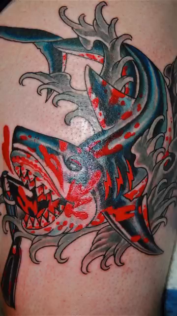 Shark with grenade pin American traditional tattoo on the forearm by @colorrobbie