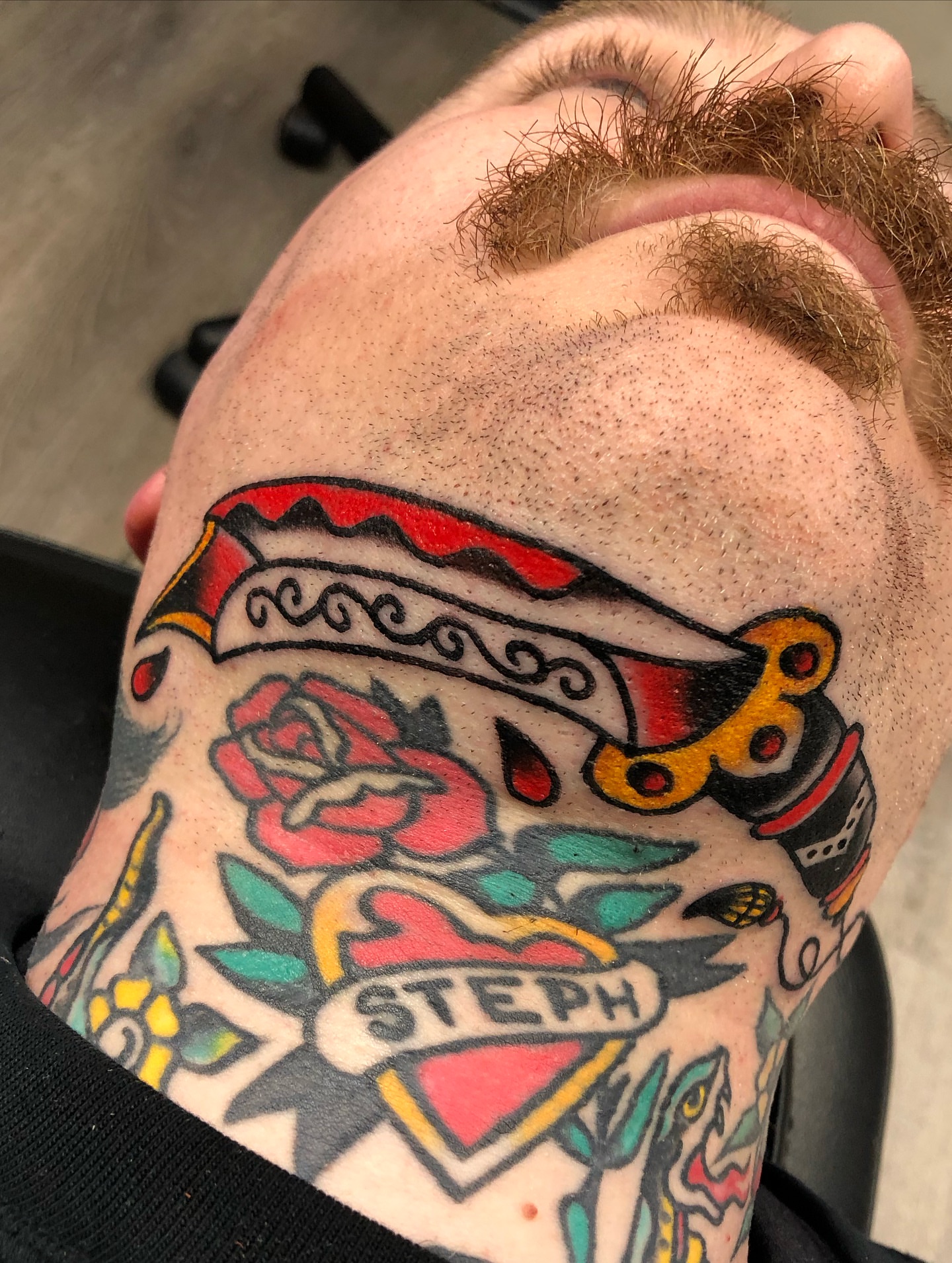 Rose and scissors American traditional tattoo on the neck by Nick Sharratt, Chicago, Illinois