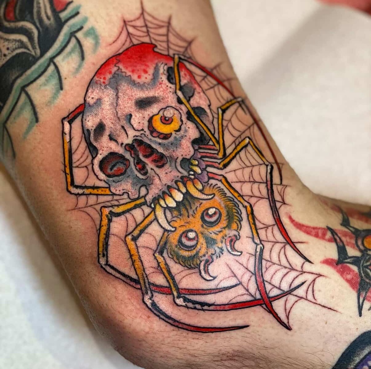 Spider and skull American traditional tattoo on the forearm by B e A U B R A D y, Costa Mesa, California