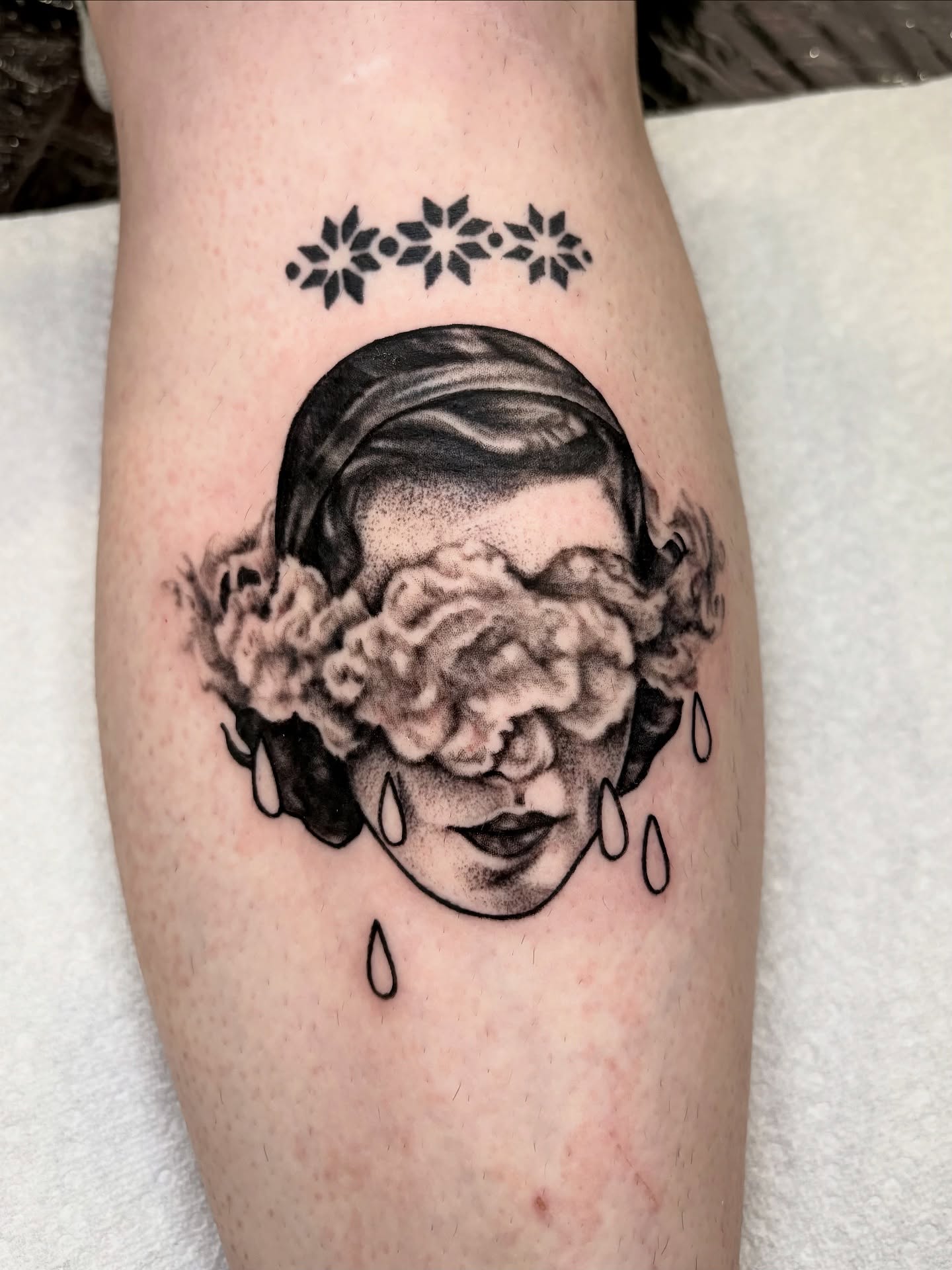 Woman with cloud dotwork tattoo on the forearm by Flor, Dallas, Texas
