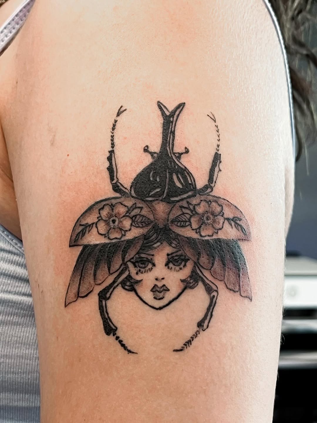 Beetle woman fine line tattoo on the upper arm by ❦julia