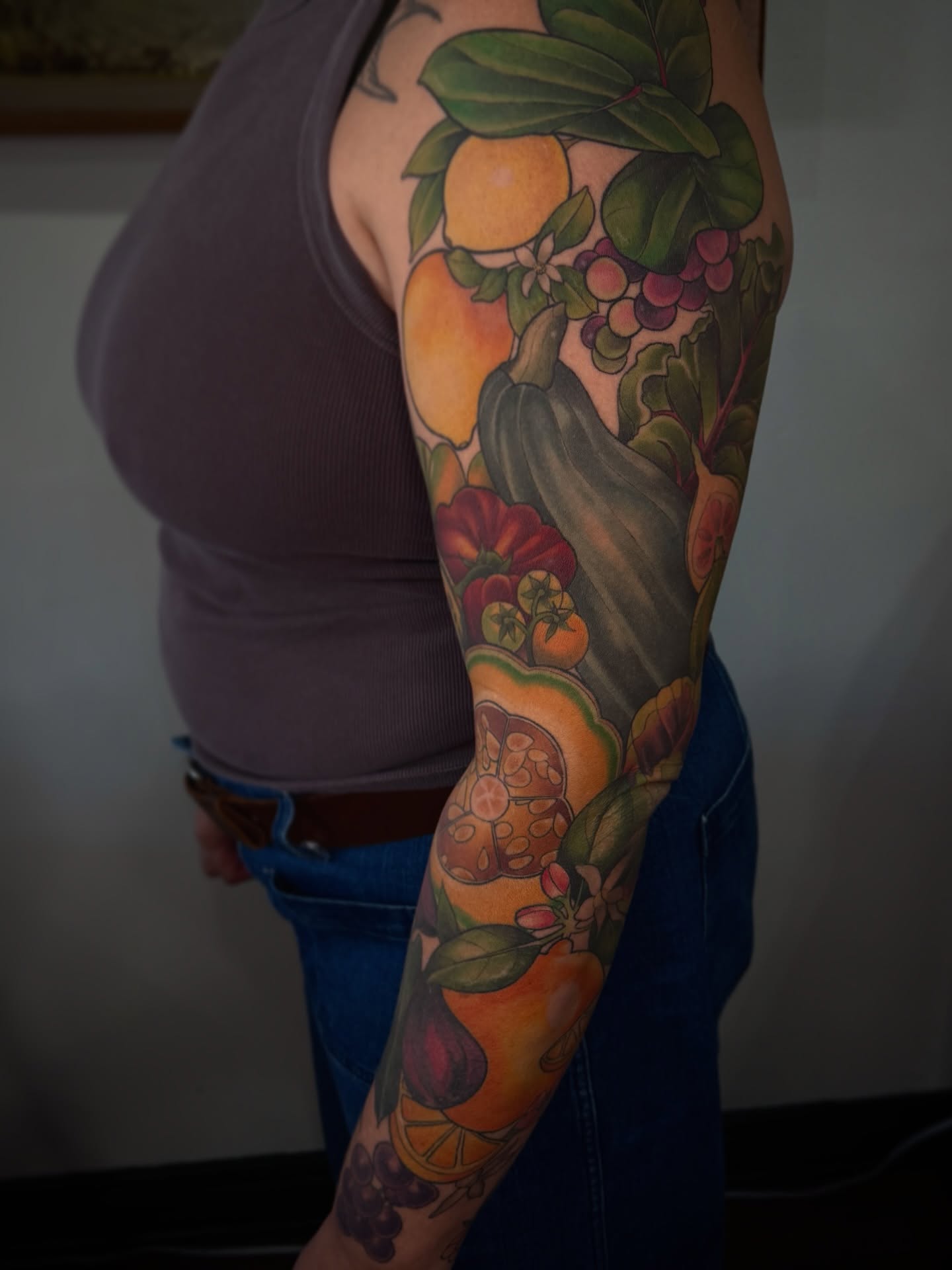 Fruit and vegetables realism tattoo on the upper arm by Alyssa Shirkey