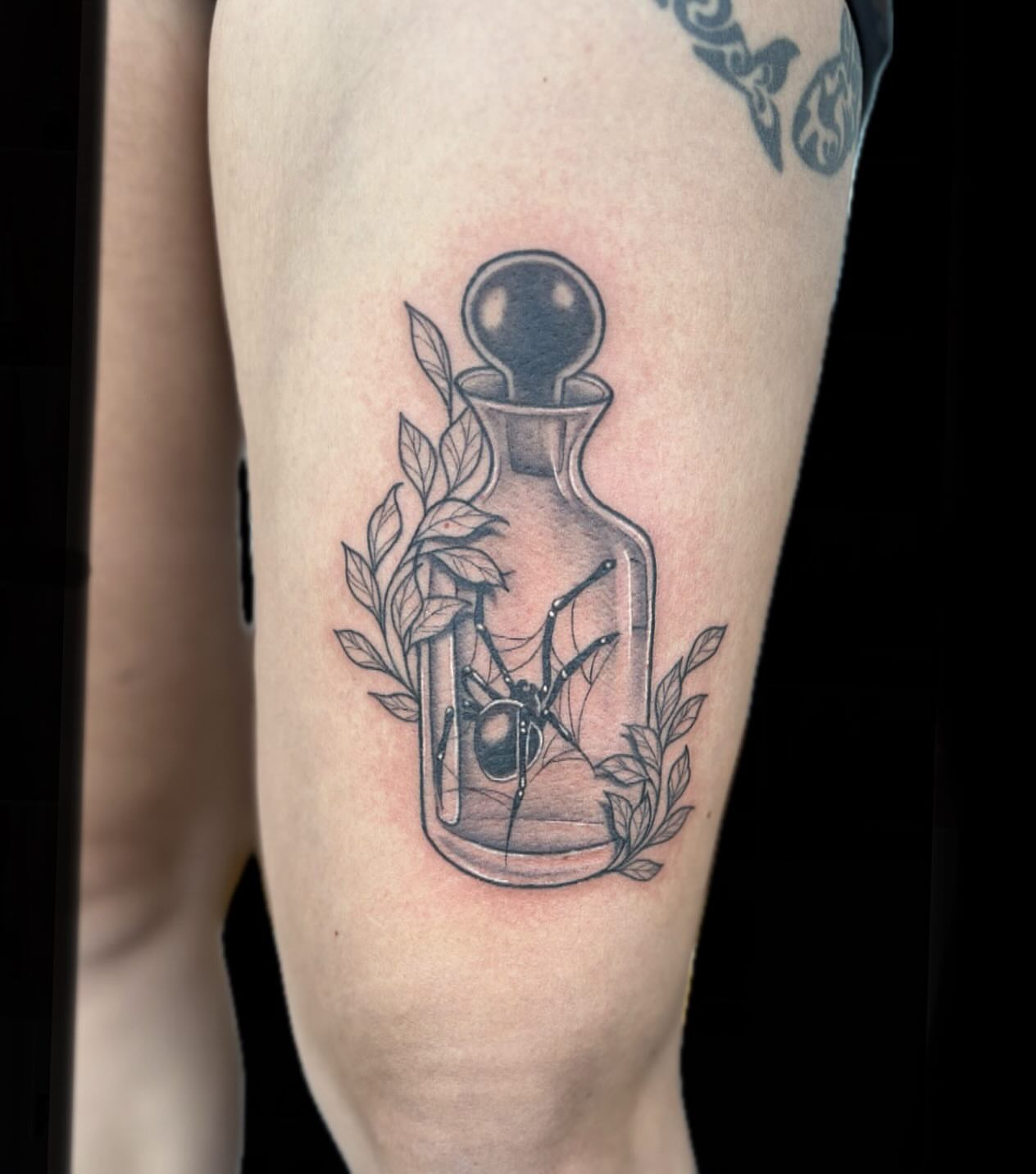 Spider in bottle black and grey tattoo on the thigh by 🖤Sabrina Ryan🖤