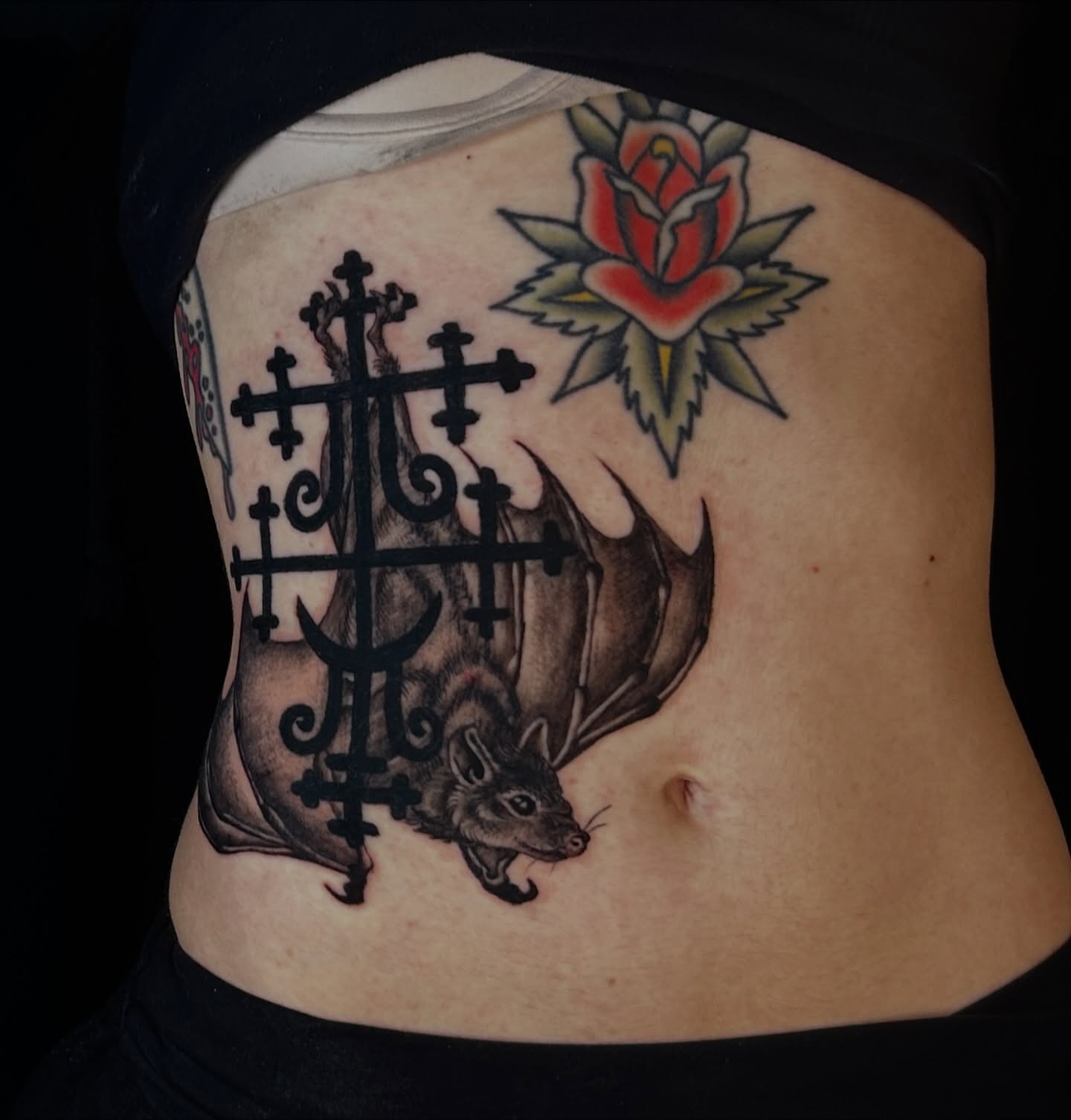 Bat and cross American traditional tattoo on the ribs by Kat McCoy Guidera, Nashville, Tennessee
