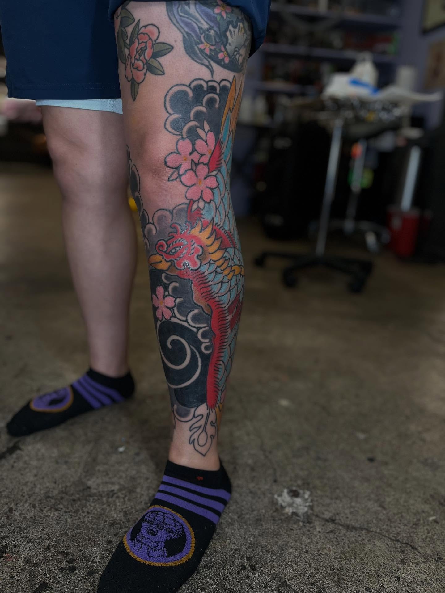 Cherry blossoms and dragon japanese irezumi tattoo on the calf by Kaichi Fujita, Eugene, Oregon