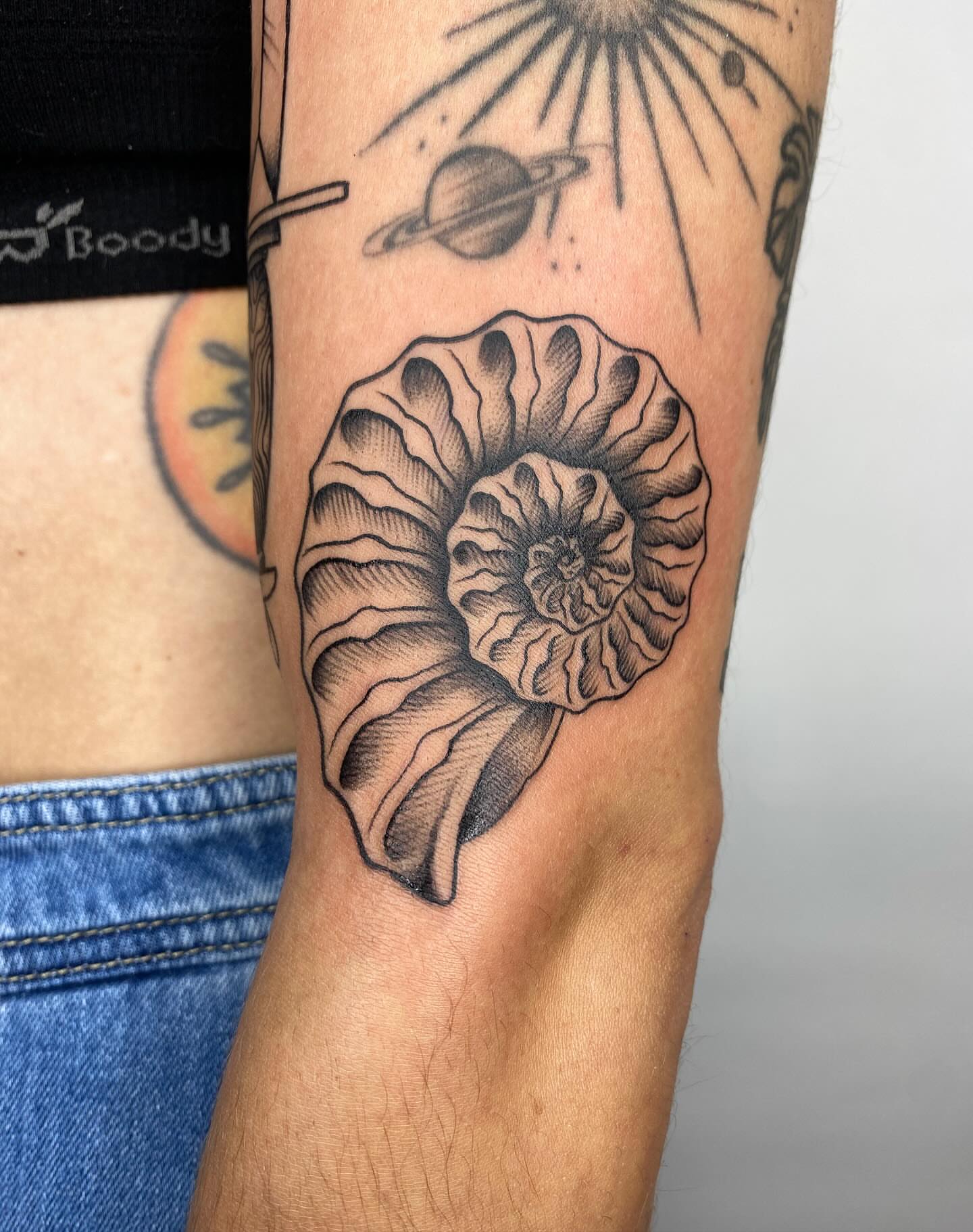 Nautilus shell realism tattoo on the forearm by Vivian HavaTattoo, Richmond, Virginia