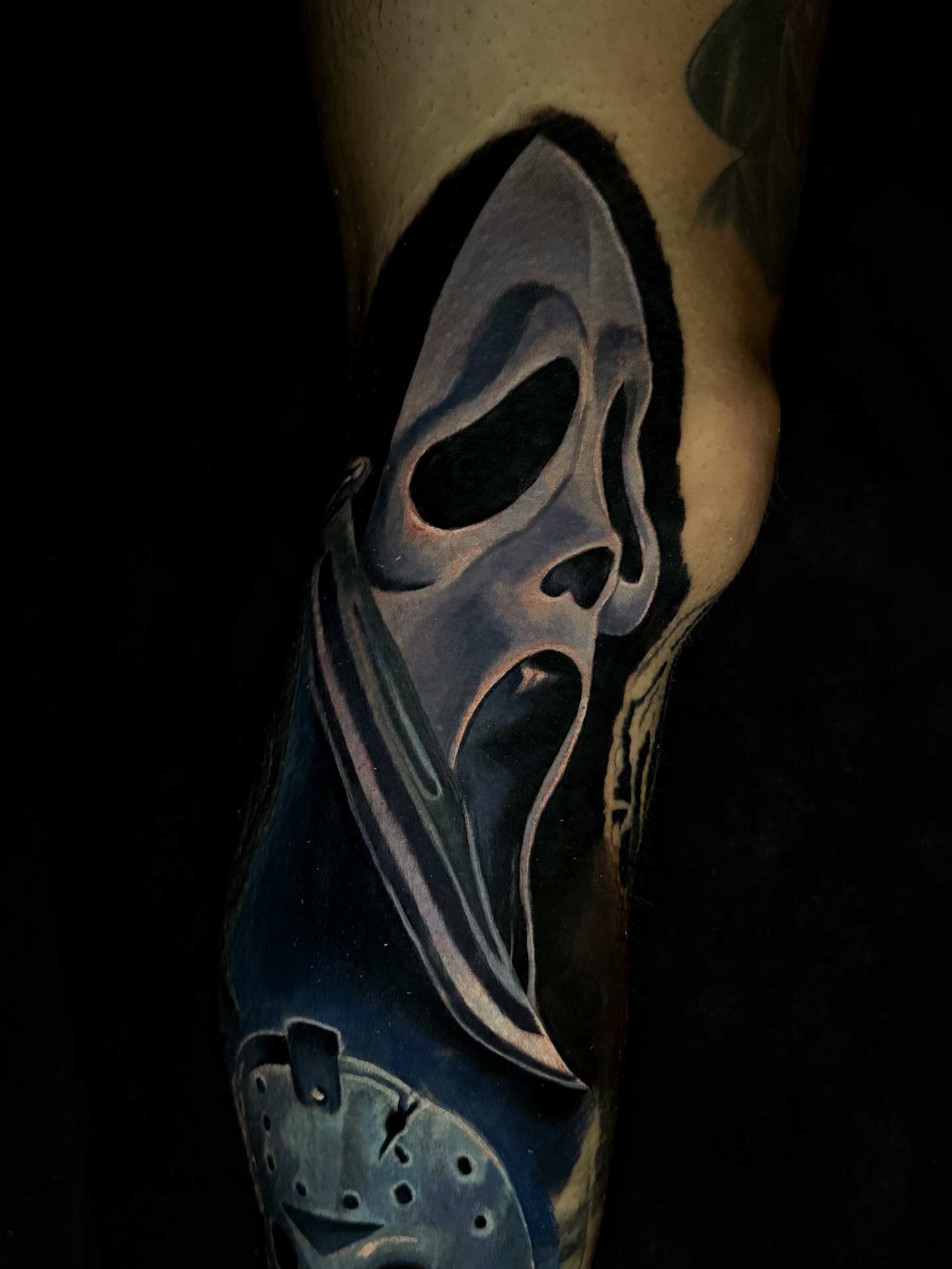 Mask realism tattoo on the forearm by Dave James