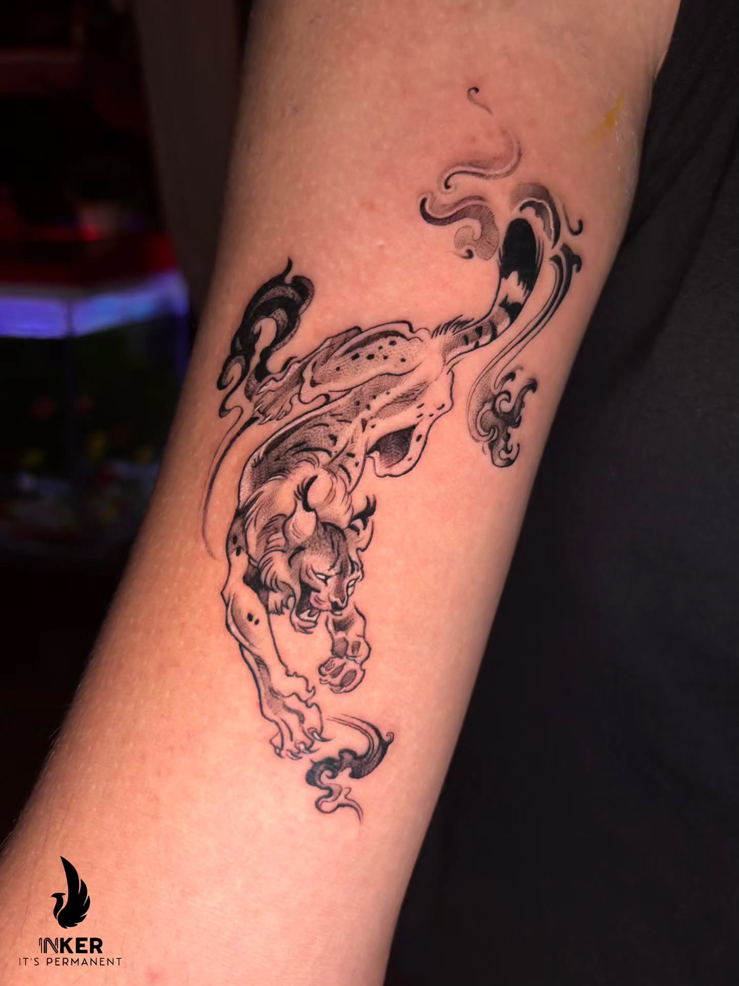 Lion black and grey tattoo on the forearm by Shubhadeep Mukherjee
