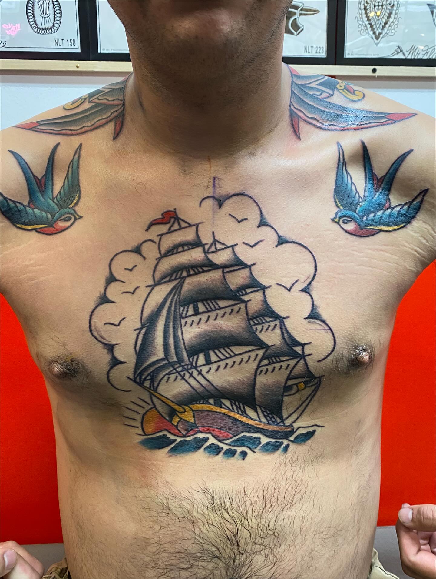 Ship sailing through clouds American traditional tattoo on the chest by Las Vegas Tattoo Artist