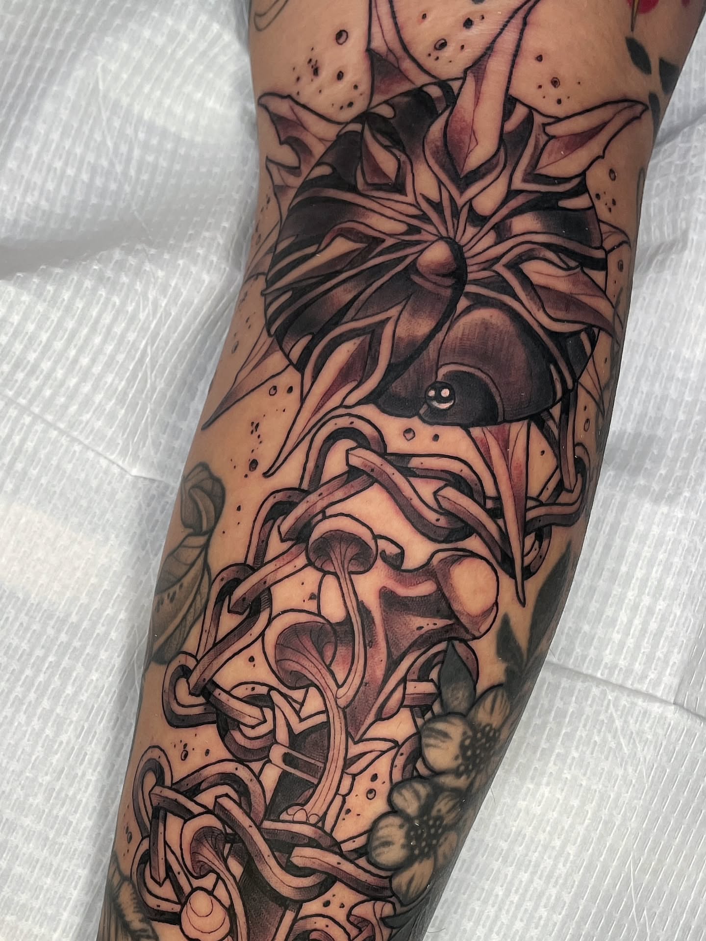 Noodles and flowers dotwork tattoo on the forearm by zoey sage ✦