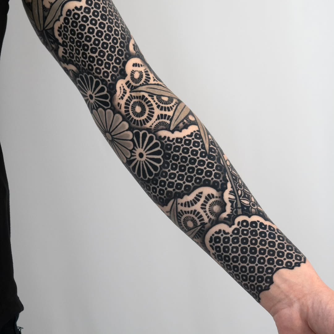 Geometric floral pattern geometric tattoo on the forearm by Kevin Ligabue