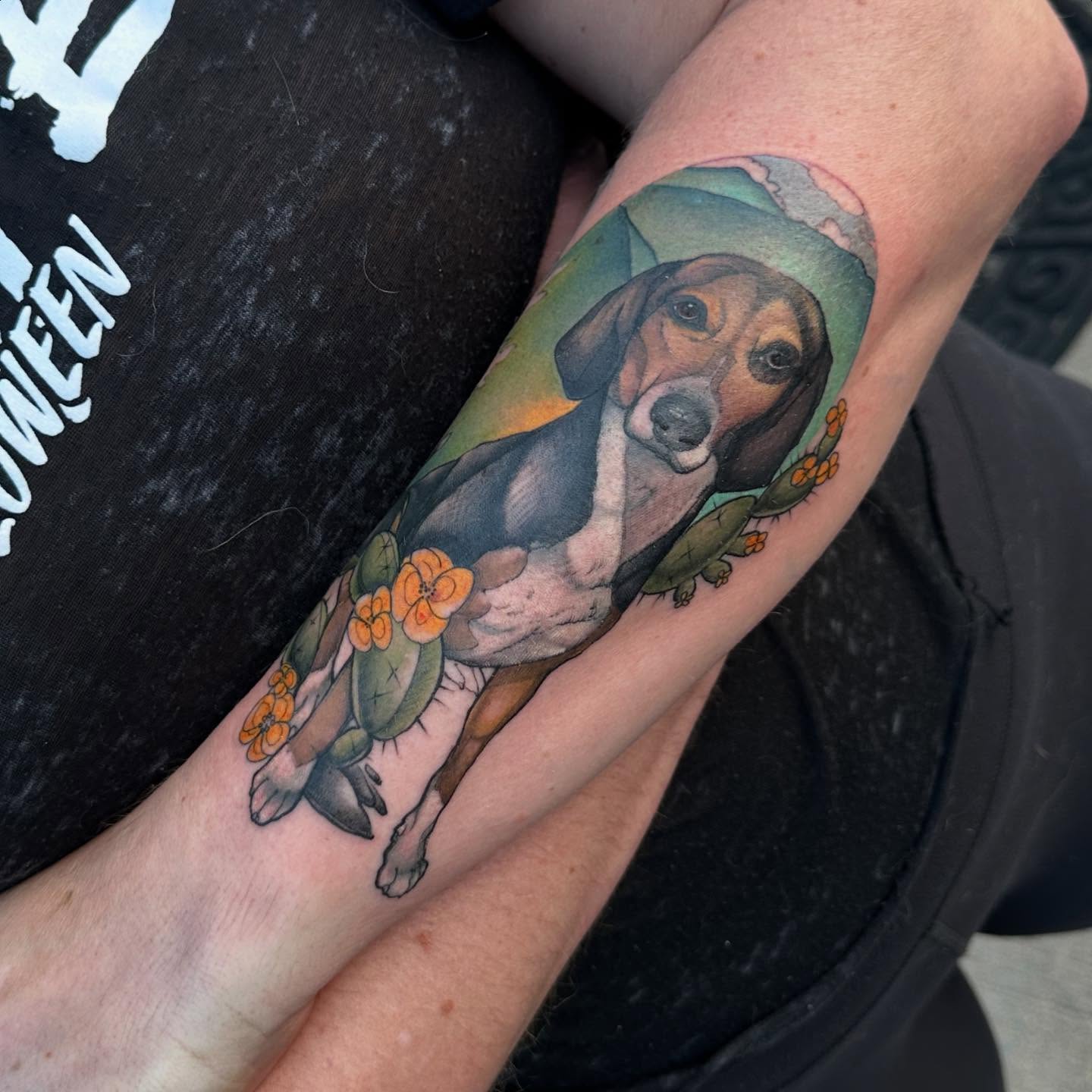 Dog with flowers realism tattoo on the forearm by Noel Martinez, Golden, Colorado