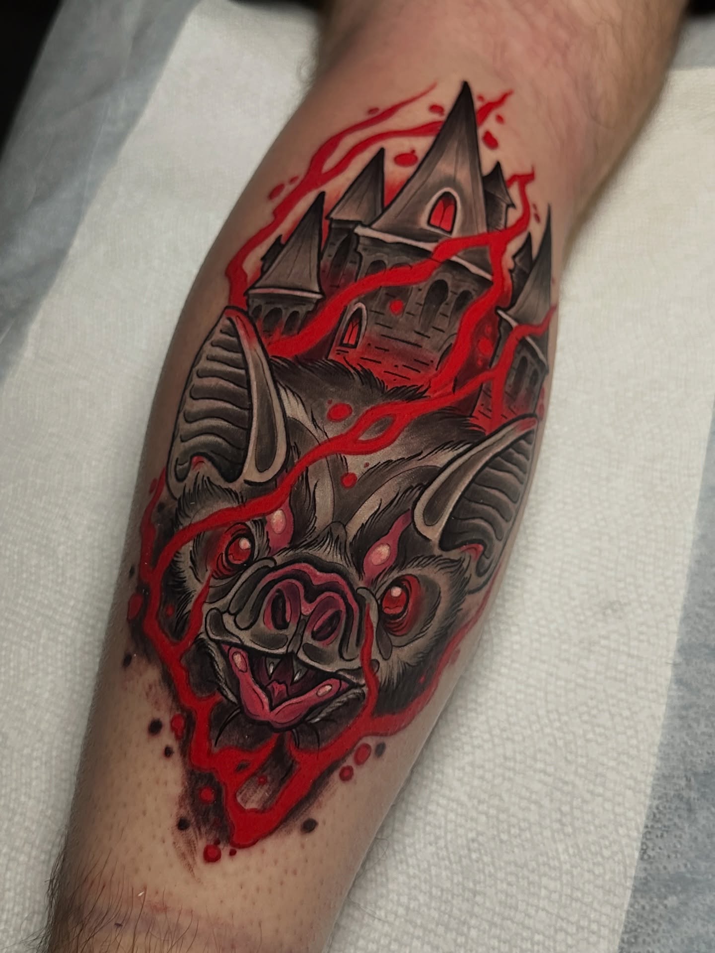 Bat and castle dark realism tattoo on the forearm by 𝐀𝐮𝐬𝐭𝐢𝐧 𝐌𝐨𝐫𝐫𝐢𝐬𝐨𝐧 𝐓𝐚𝐭𝐭𝐨𝐨𝐬