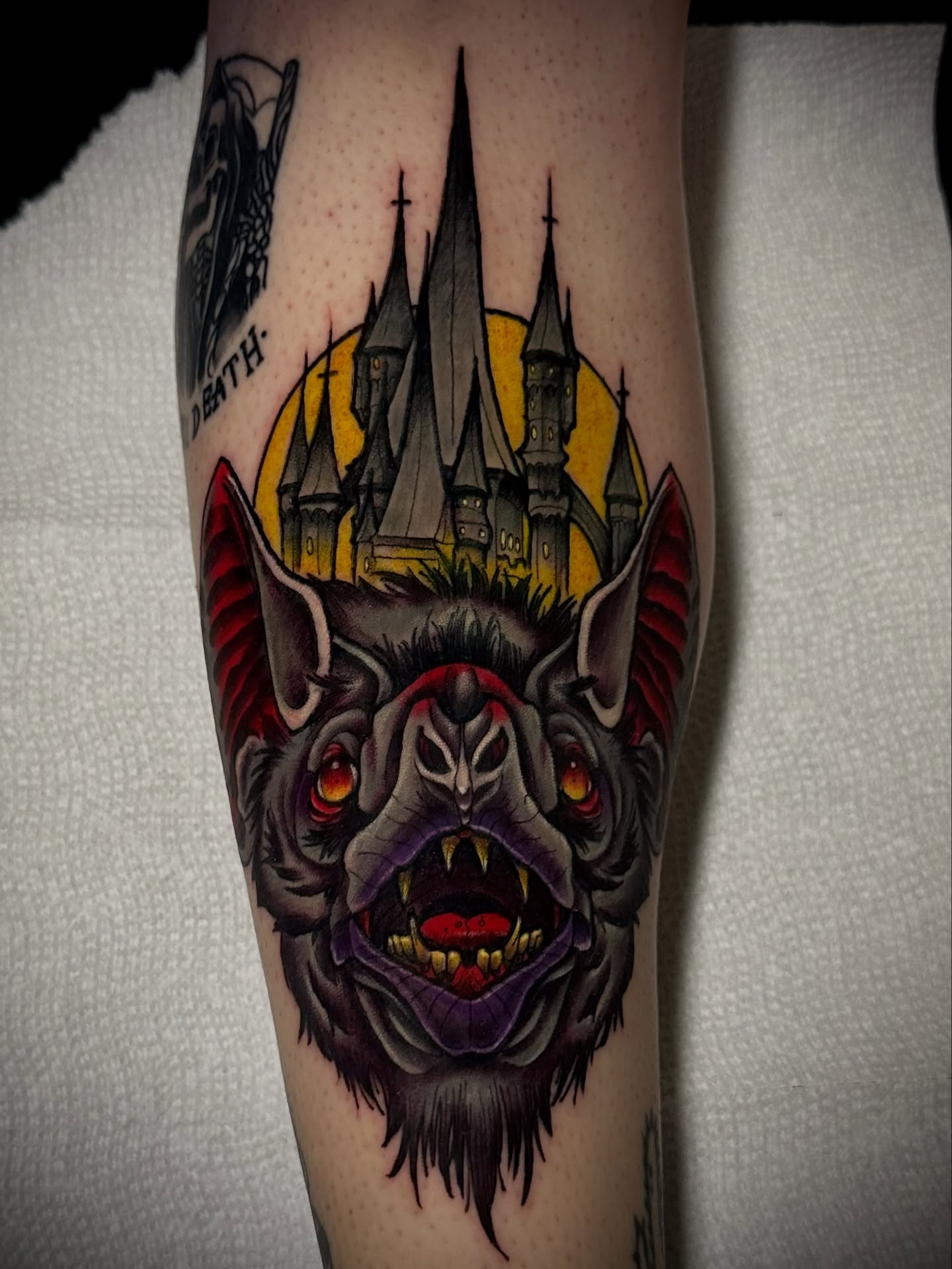 Bat and castle dark realism tattoo on the forearm by 𝐀𝐮𝐬𝐭𝐢𝐧 𝐌𝐨𝐫𝐫𝐢𝐬𝐨𝐧 𝐓𝐚𝐭𝐭𝐨𝐨𝐬
