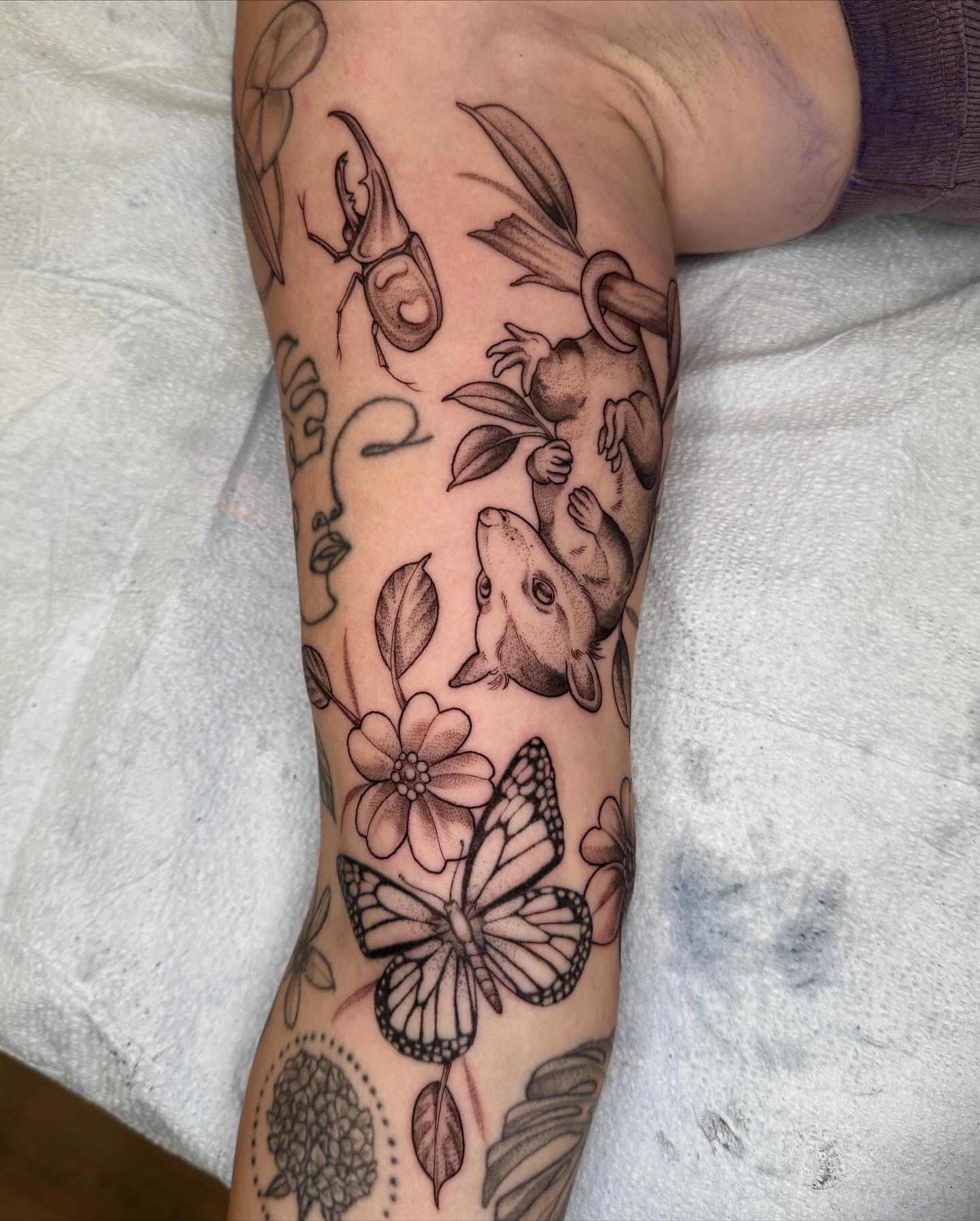 Insects and flowers black and grey tattoo on the forearm by 🌸delaney🌸