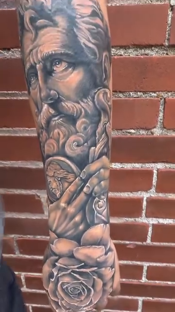 Man's bust and rose realism tattoo by Blake Van Vleck