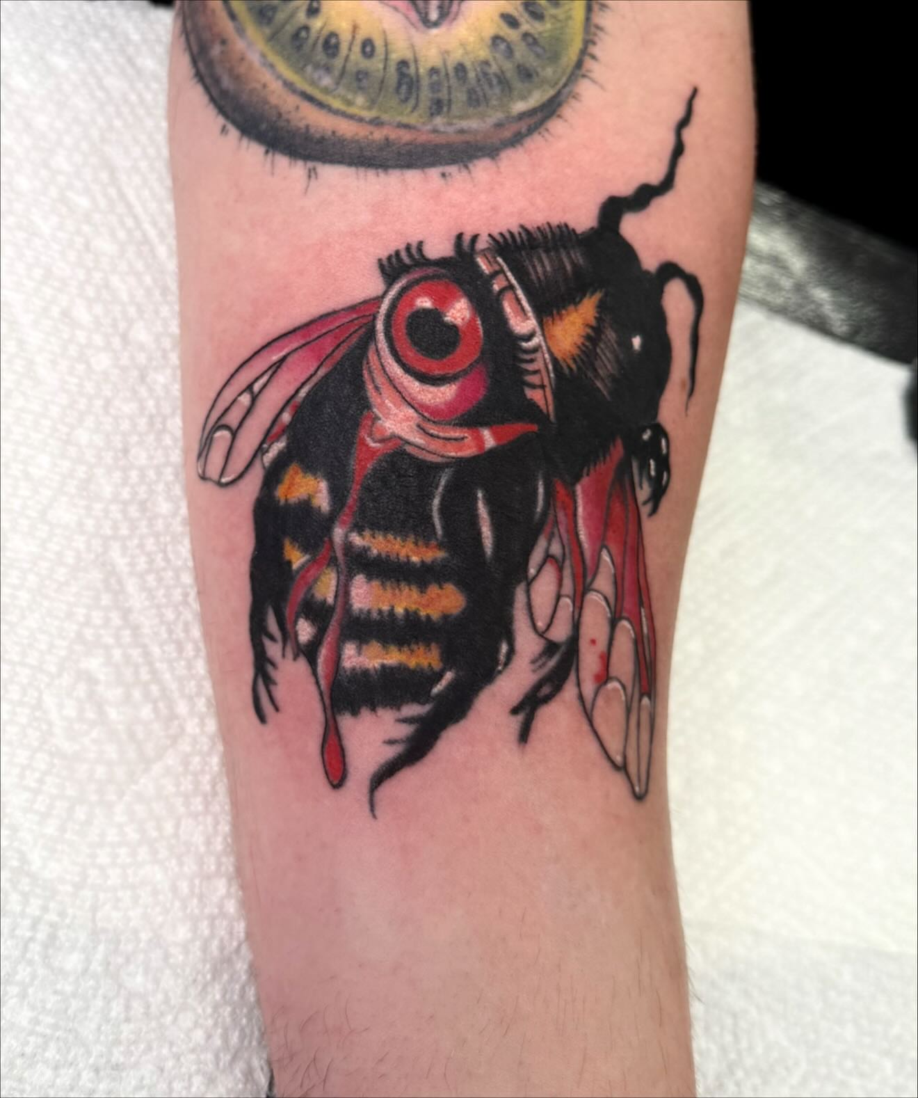 Bee American traditional tattoo on the forearm by Emmy