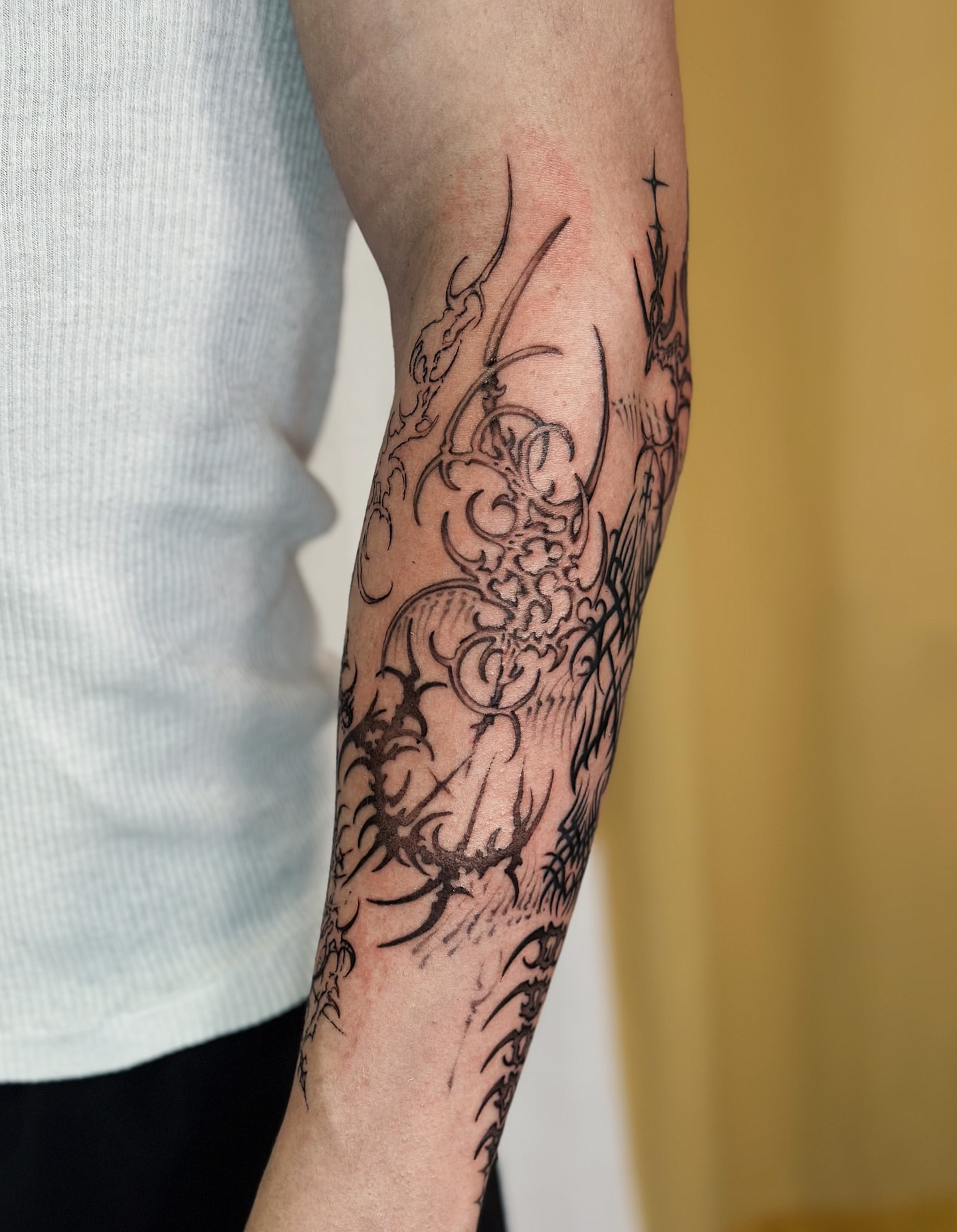 Dragon black and grey tattoo on the forearm by Lauryn Jenesis