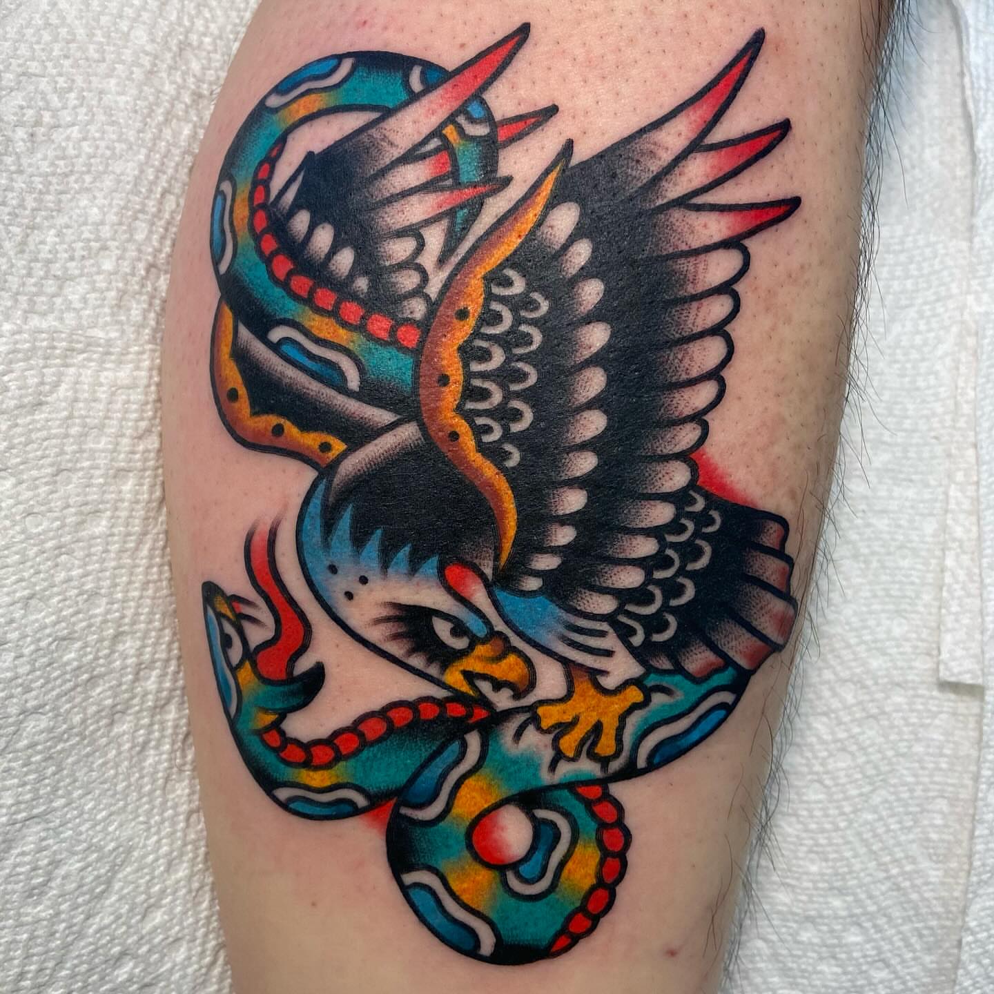 Eagle and snake American traditional tattoo on the forearm by Anthony Jaeger, Seattle, Washington