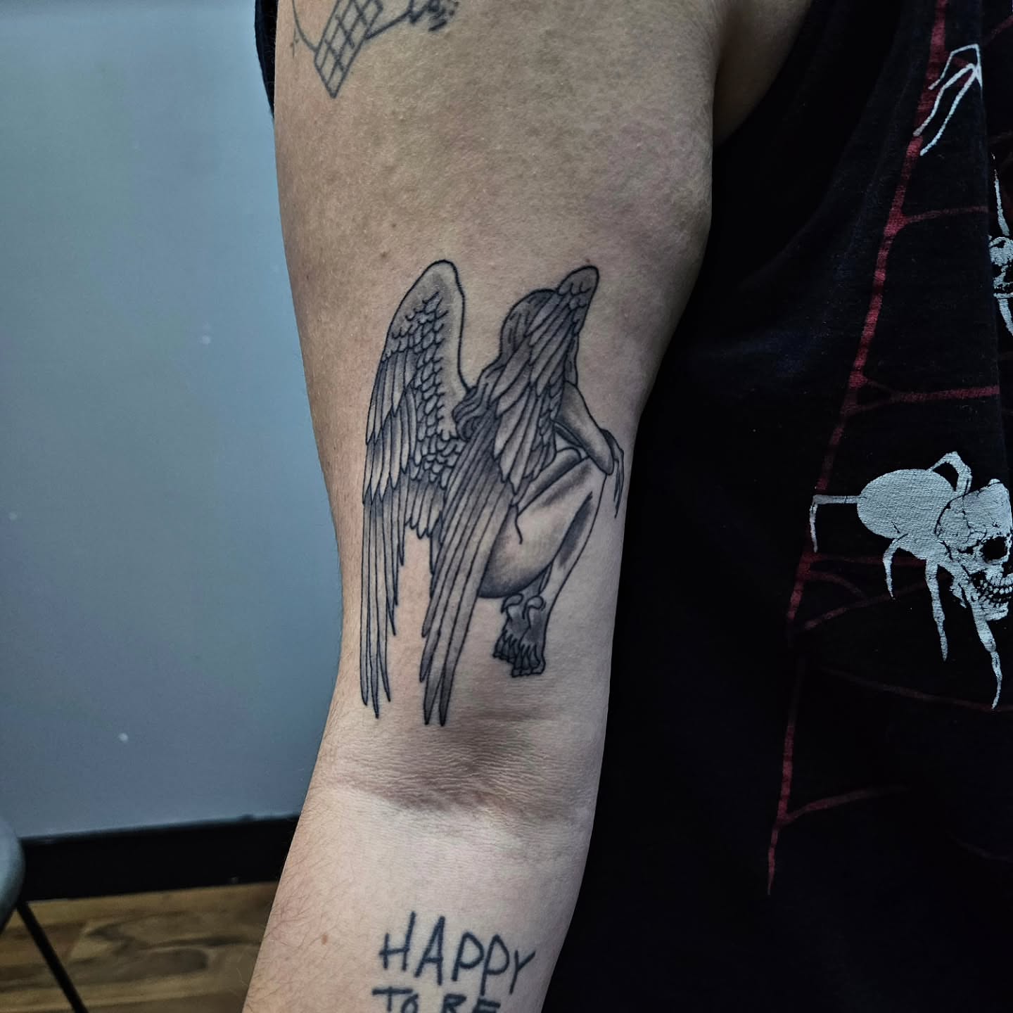 Angel black and grey tattoo on the forearm by Danny