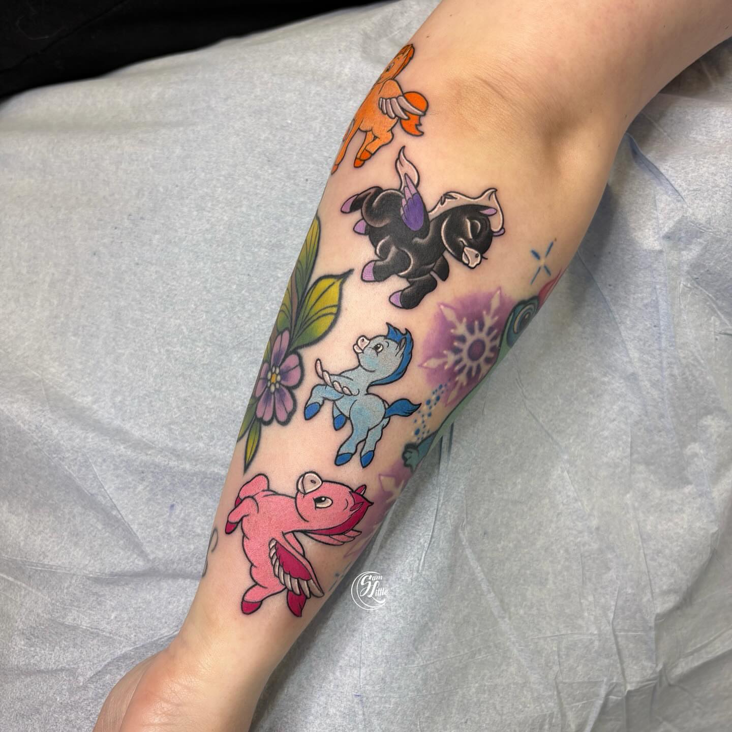 Mythical creatures and flowers new school tattoo on the forearm by 𝓢𝓪𝓶 𝓛𝓲𝓽𝓽𝓵𝓮