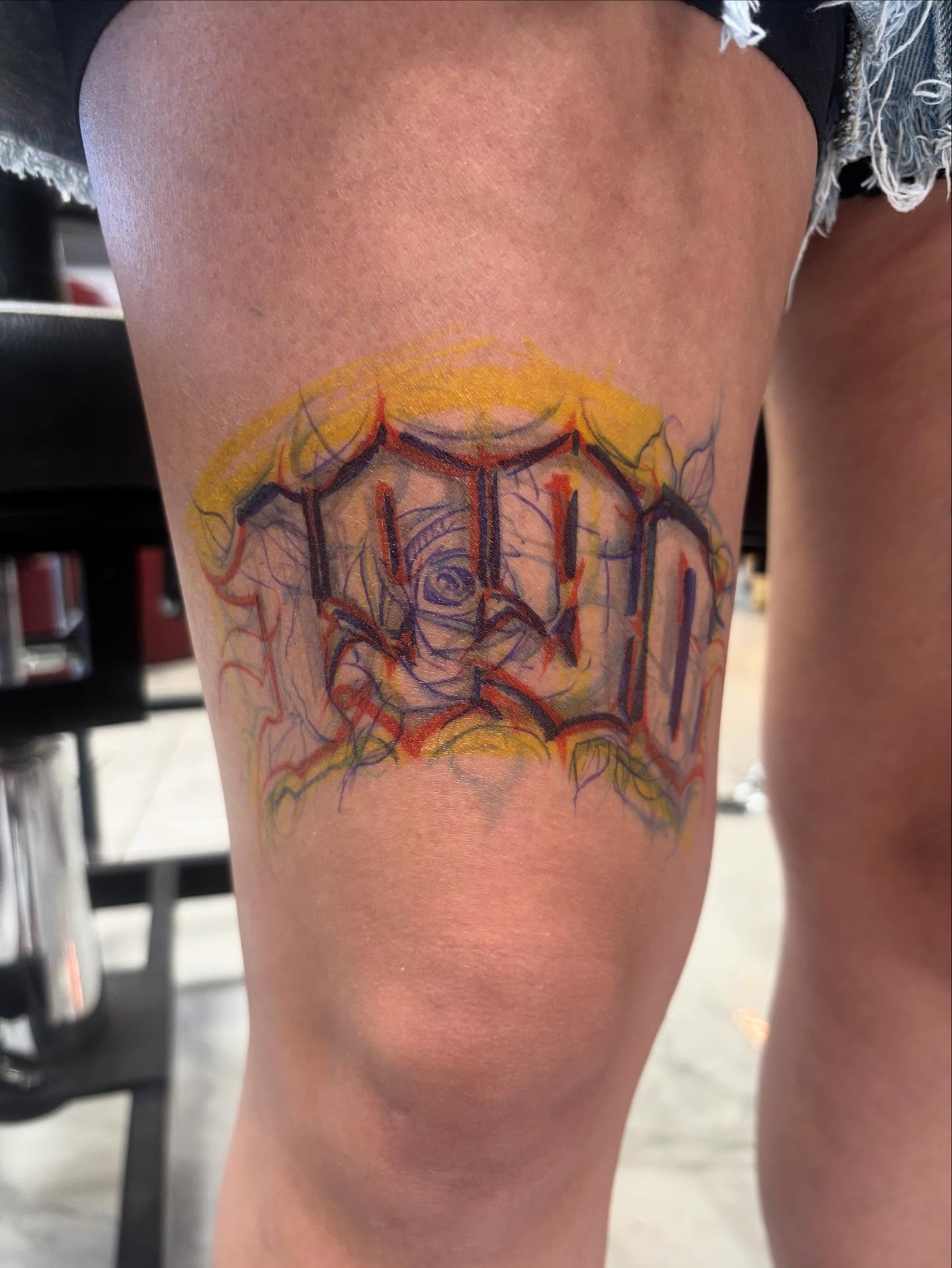 Graffiti-style lettering tattoo on the thigh by Ashley brown, Las Vegas, Nevada