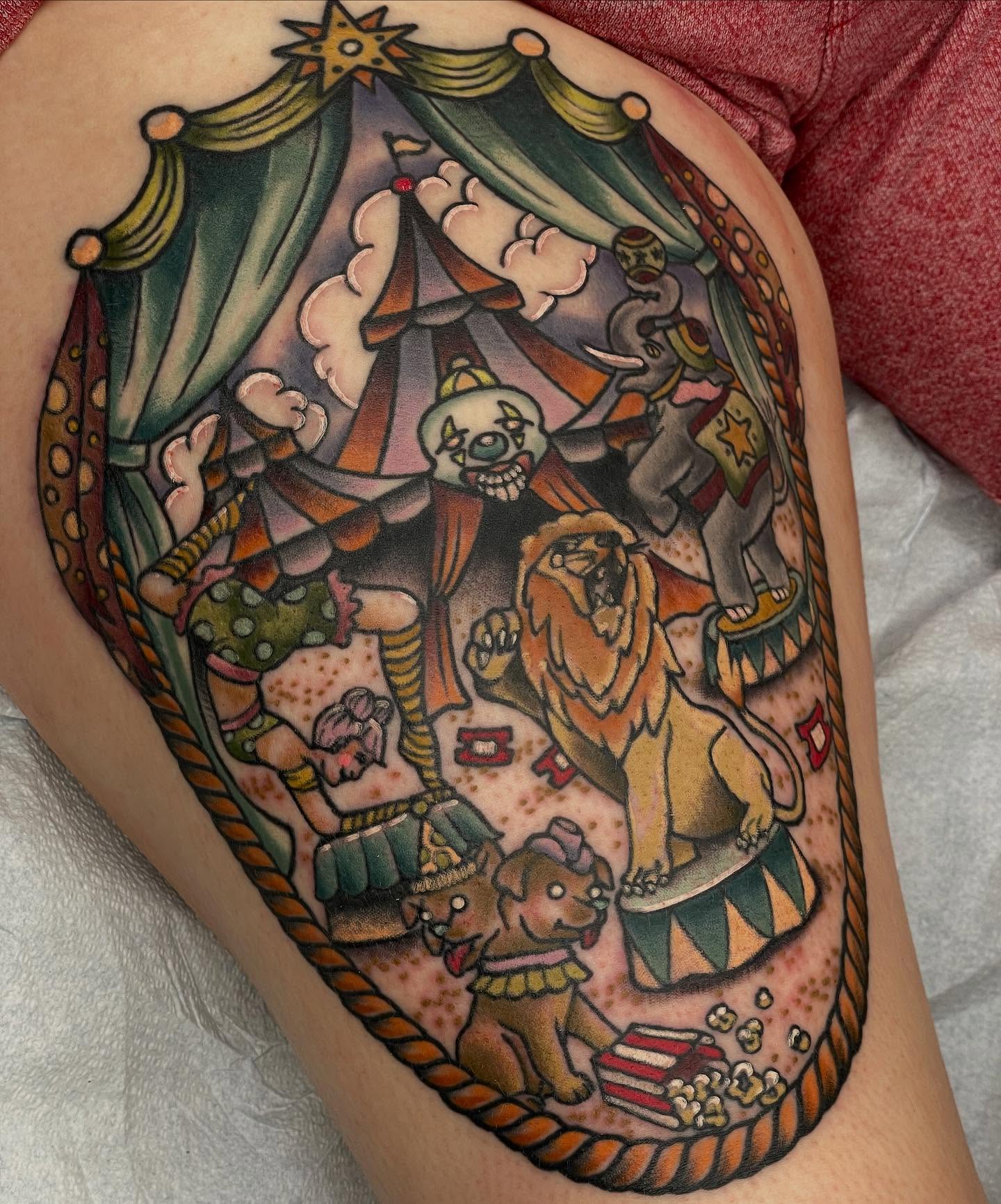 Circus scene American traditional tattoo on the thigh by Beeker, Bellingham, Washington