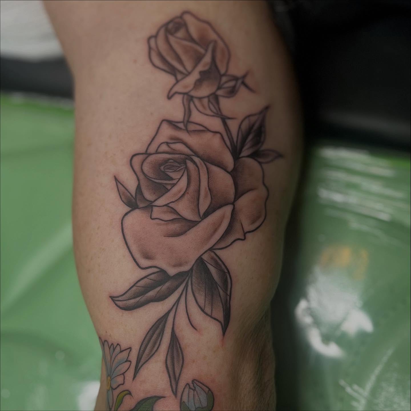 Roses black and grey tattoo on the forearm by Lexi Ross