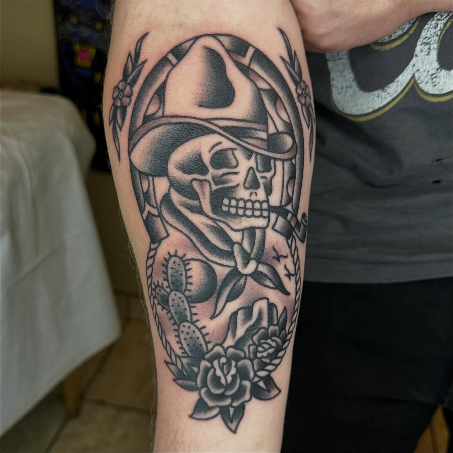 Skull with cowboy hat American traditional tattoo on the forearm by Keon Ostby, Tempe, Arizona