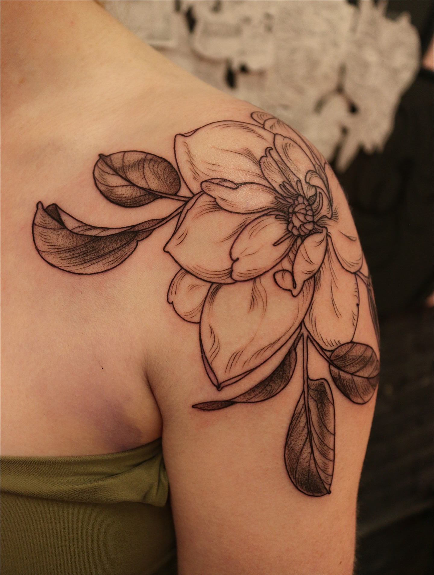 Magnolia flower black and grey tattoo on the shoulder by Summer Balcom M.