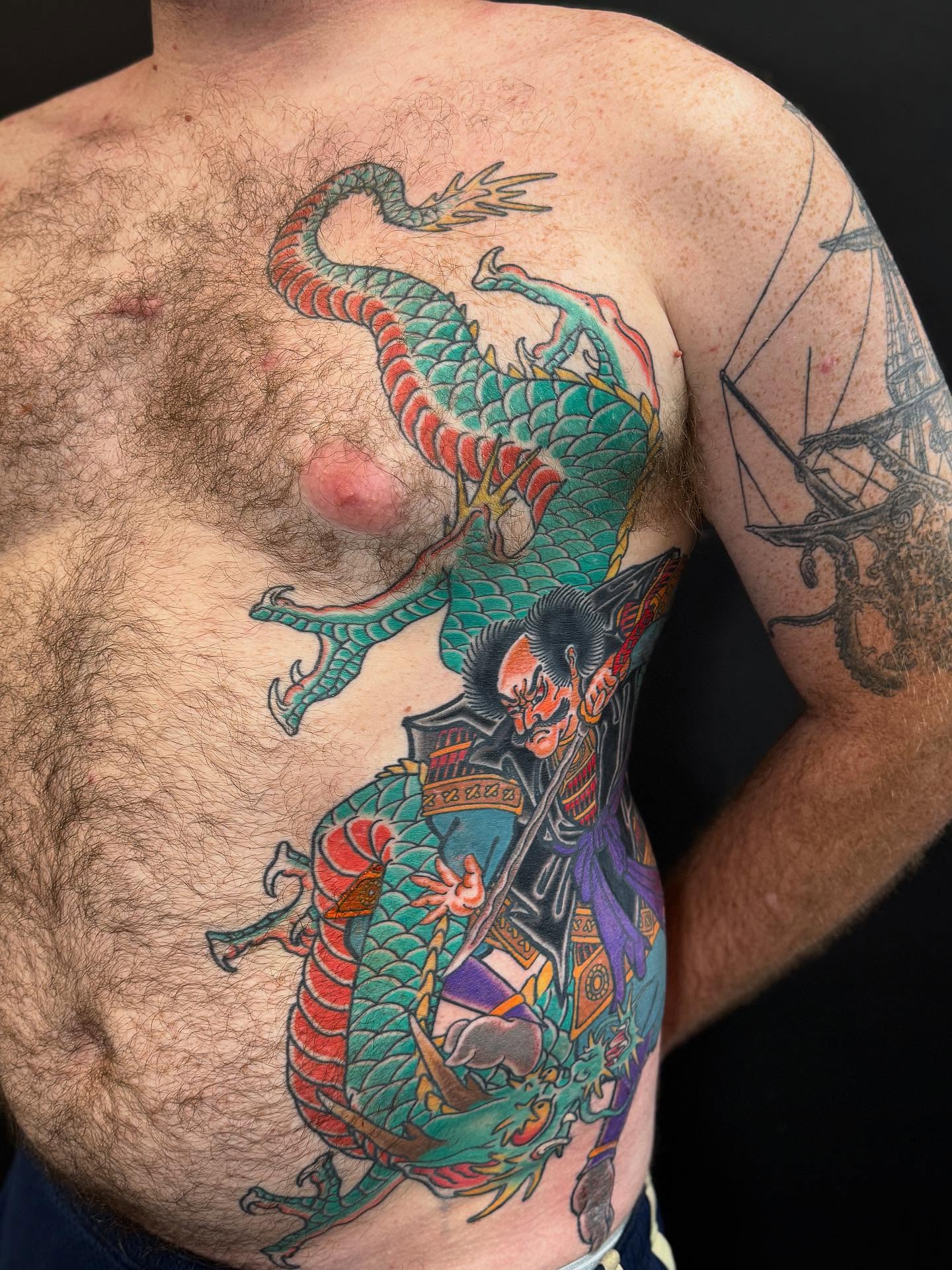 Dragon and samurai American traditional tattoo on the chest by Cole Pittman Memphis Tattoo artist, Memphis, Tennessee