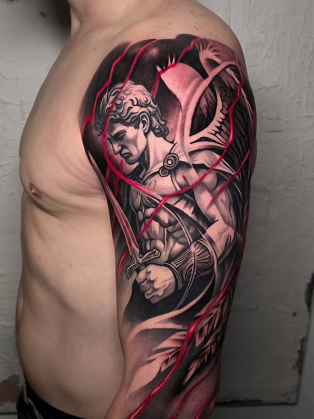 Warrior realism tattoo on the upper arm by Lukasz Olszanski