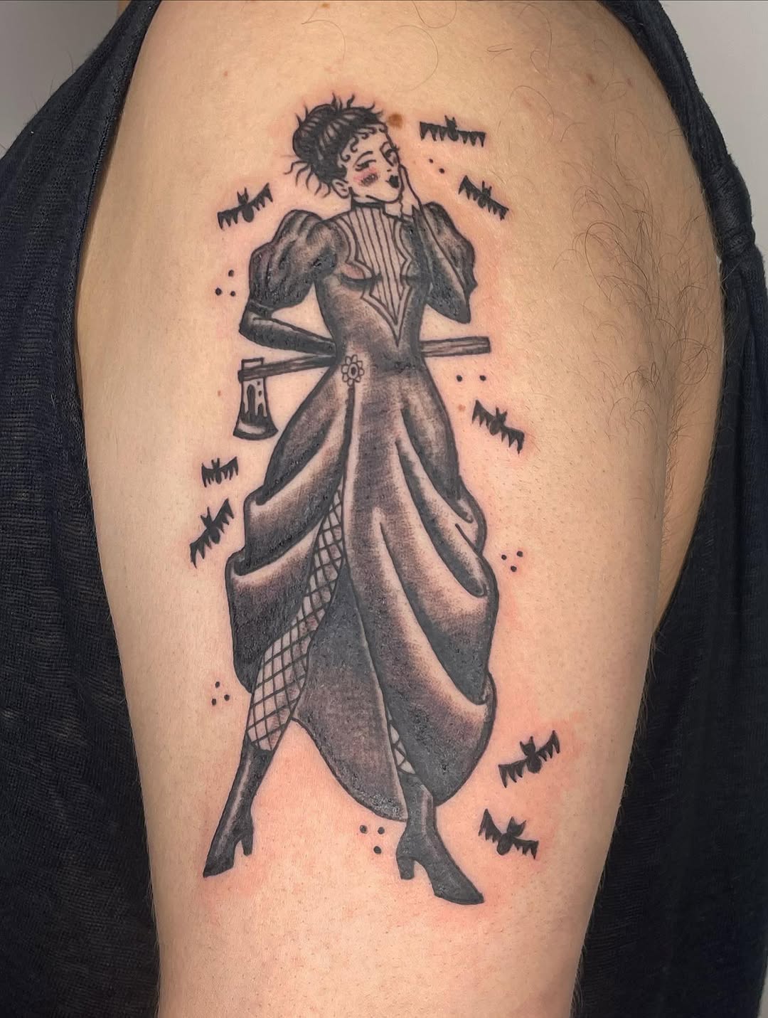 Woman with axe and bats dark art tattoo on the shoulder by Fin :
