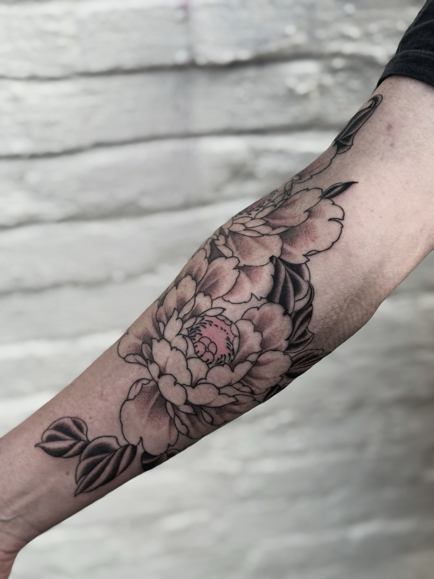 Peony black and grey tattoo on the forearm by Virginia 🥀Neo Traditional