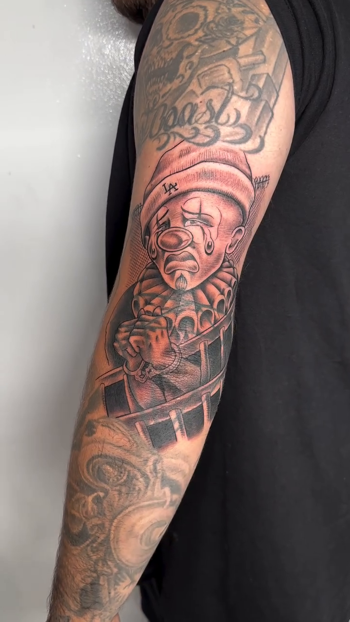 Sad clown Chicano tattoo by Yari, Los Angeles, California