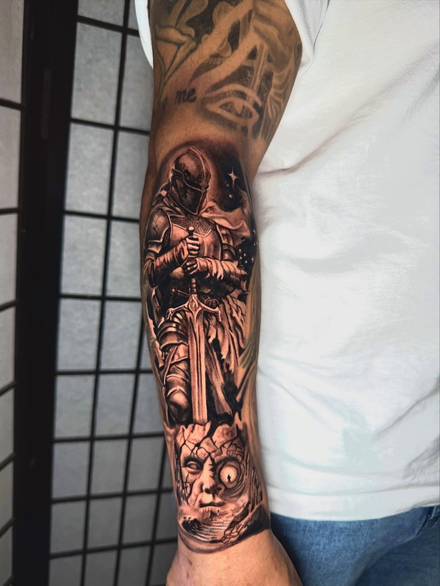 Knight and skull realism tattoo on the forearm by Daniel Ruiz