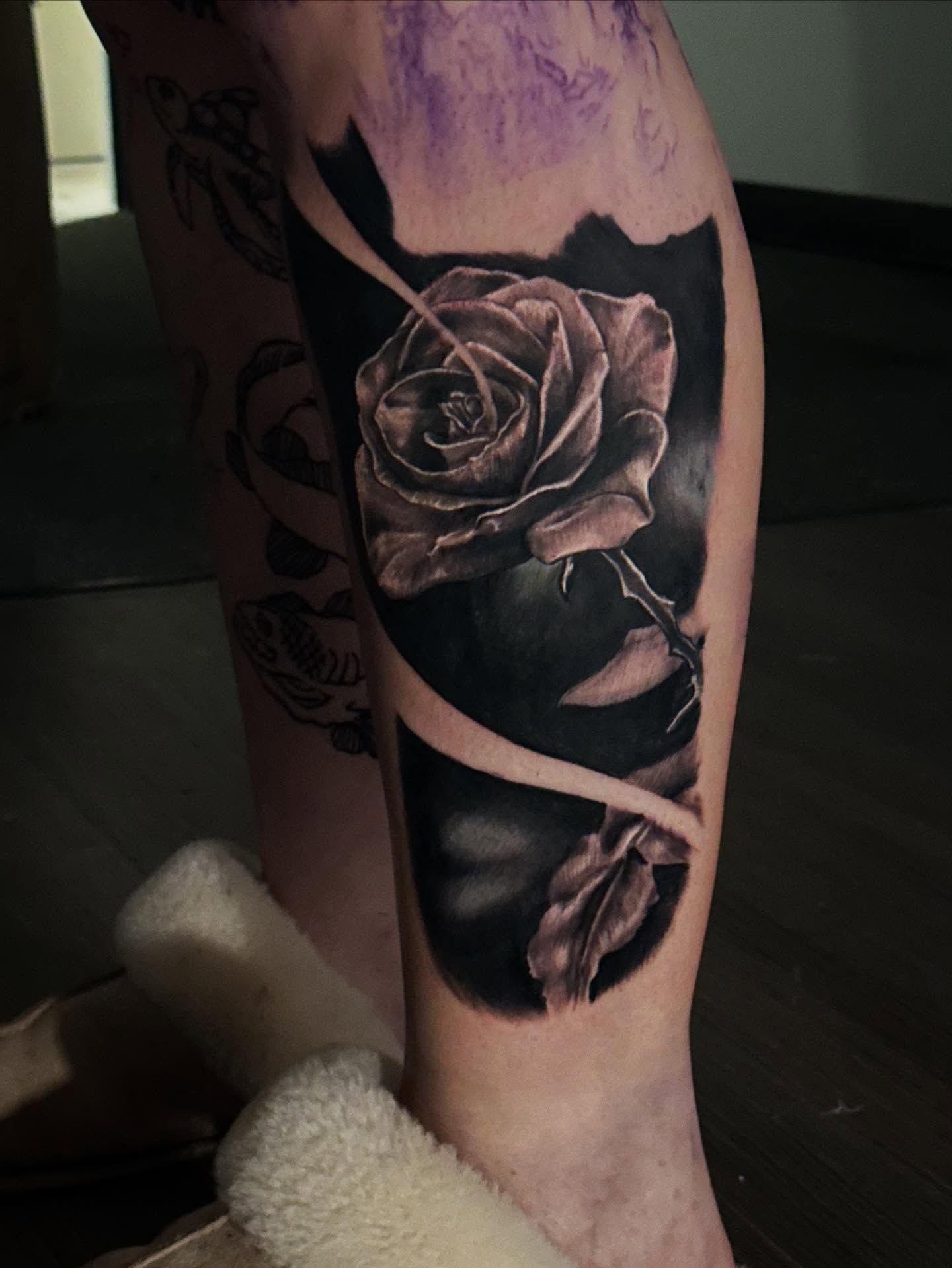 Rose realism tattoo on the calf by Neil5one3