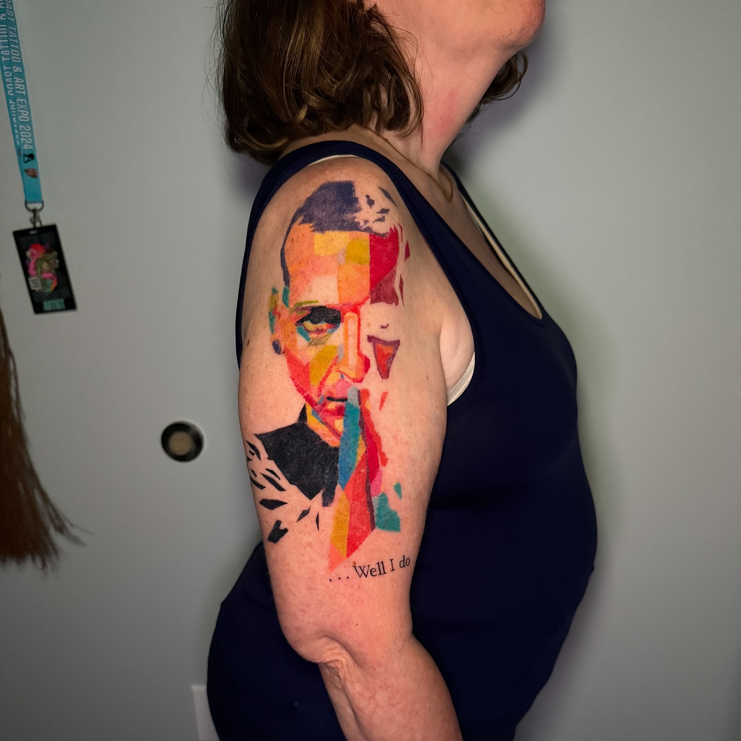 Abstract portrait geometric tattoo on the upper arm by 𝕹𝖆𝖙