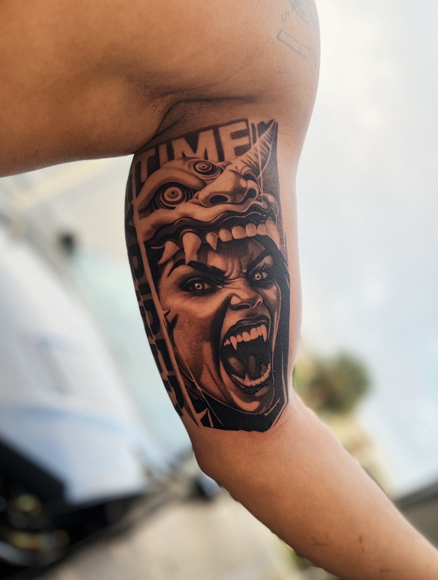 Angry face dark realism tattoo on the forearm by Crooks Ink ✞