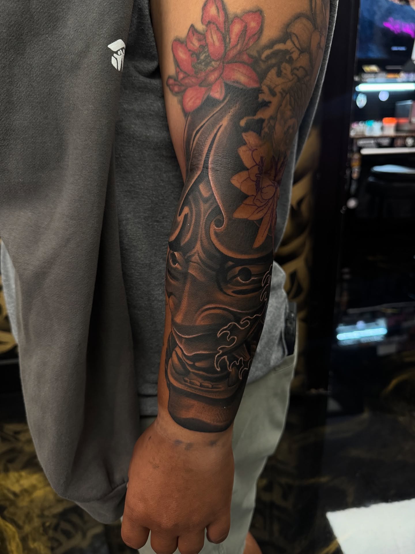 Floral and abstract realism tattoo on the forearm by Fernando Luna