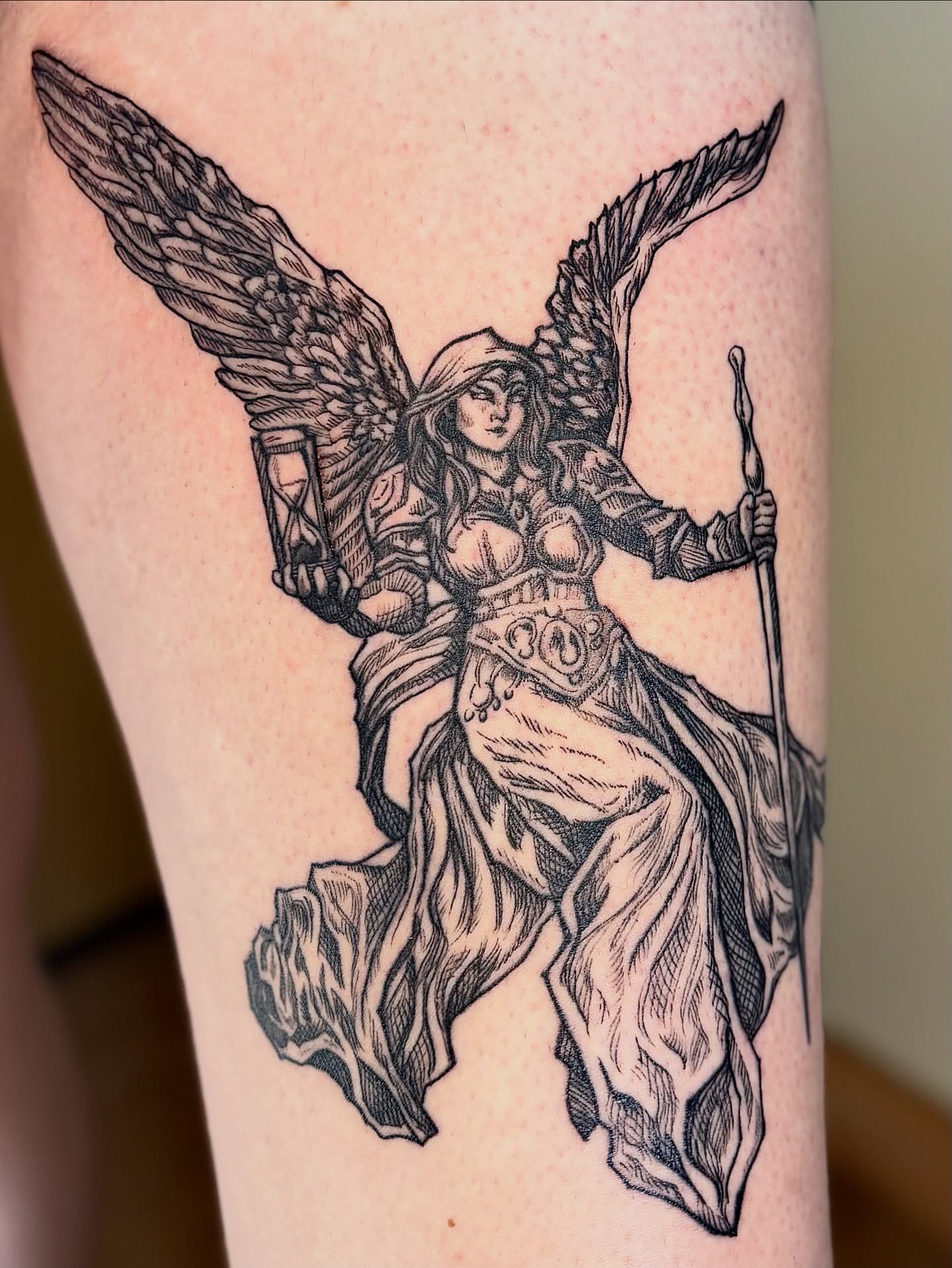 Angelic warrior black and grey tattoo on the thigh by Wren Cavanaugh Tattoos, Seattle, Washington