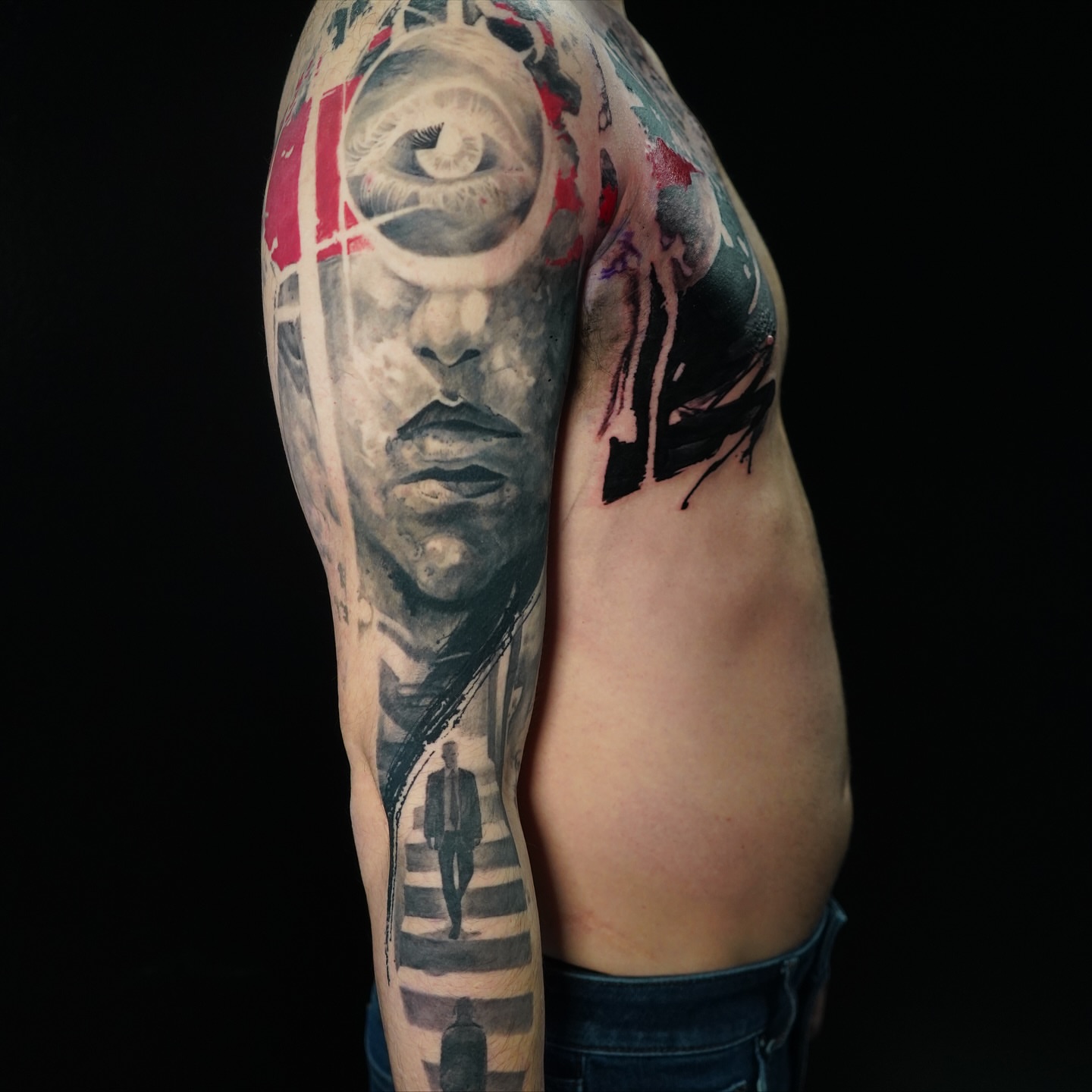 Portrait realism tattoo on the upper arm by Darl Gnau