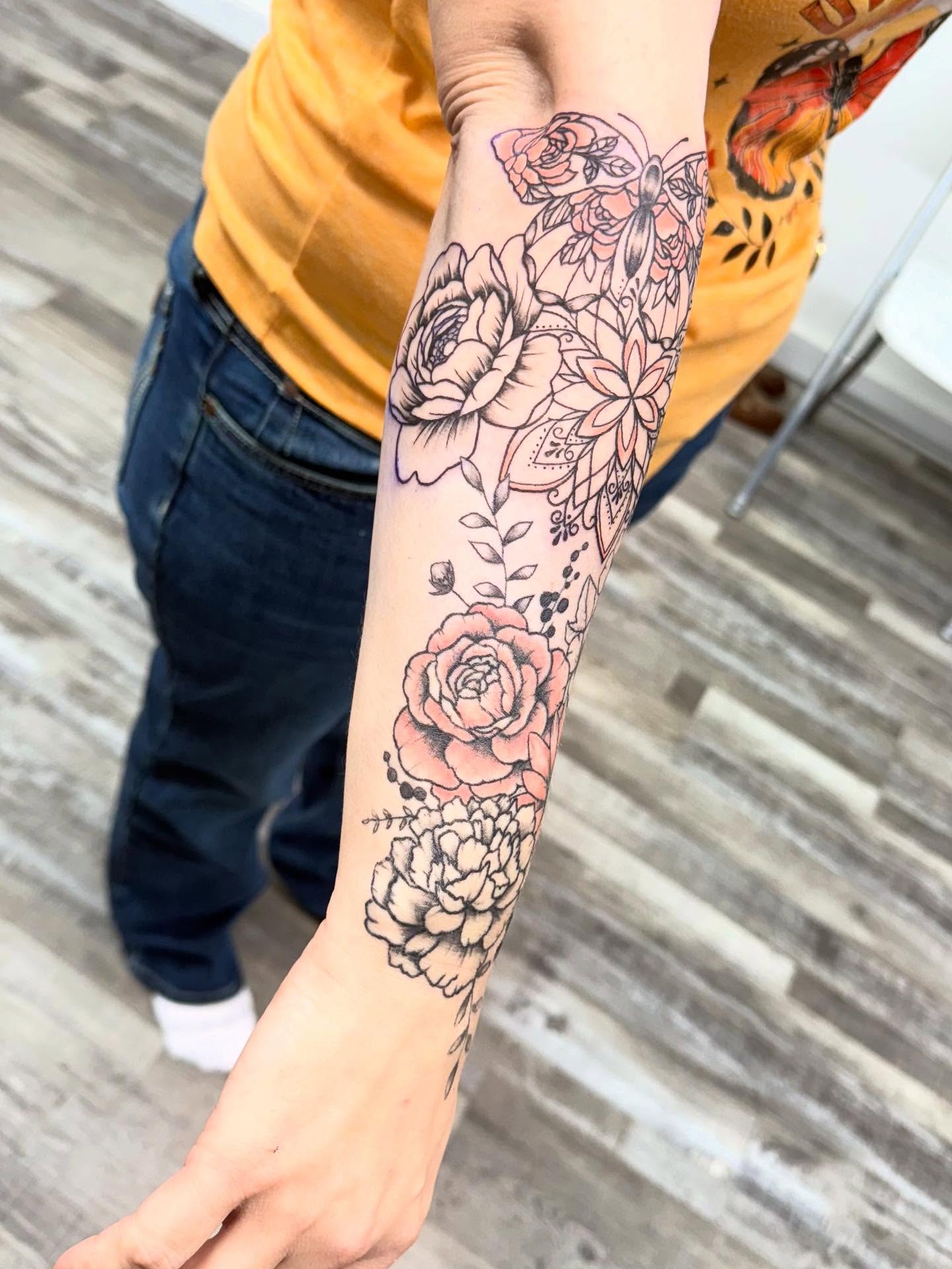 Floral bouquet black and grey tattoo on the forearm by Harlow ❤️‍🔥