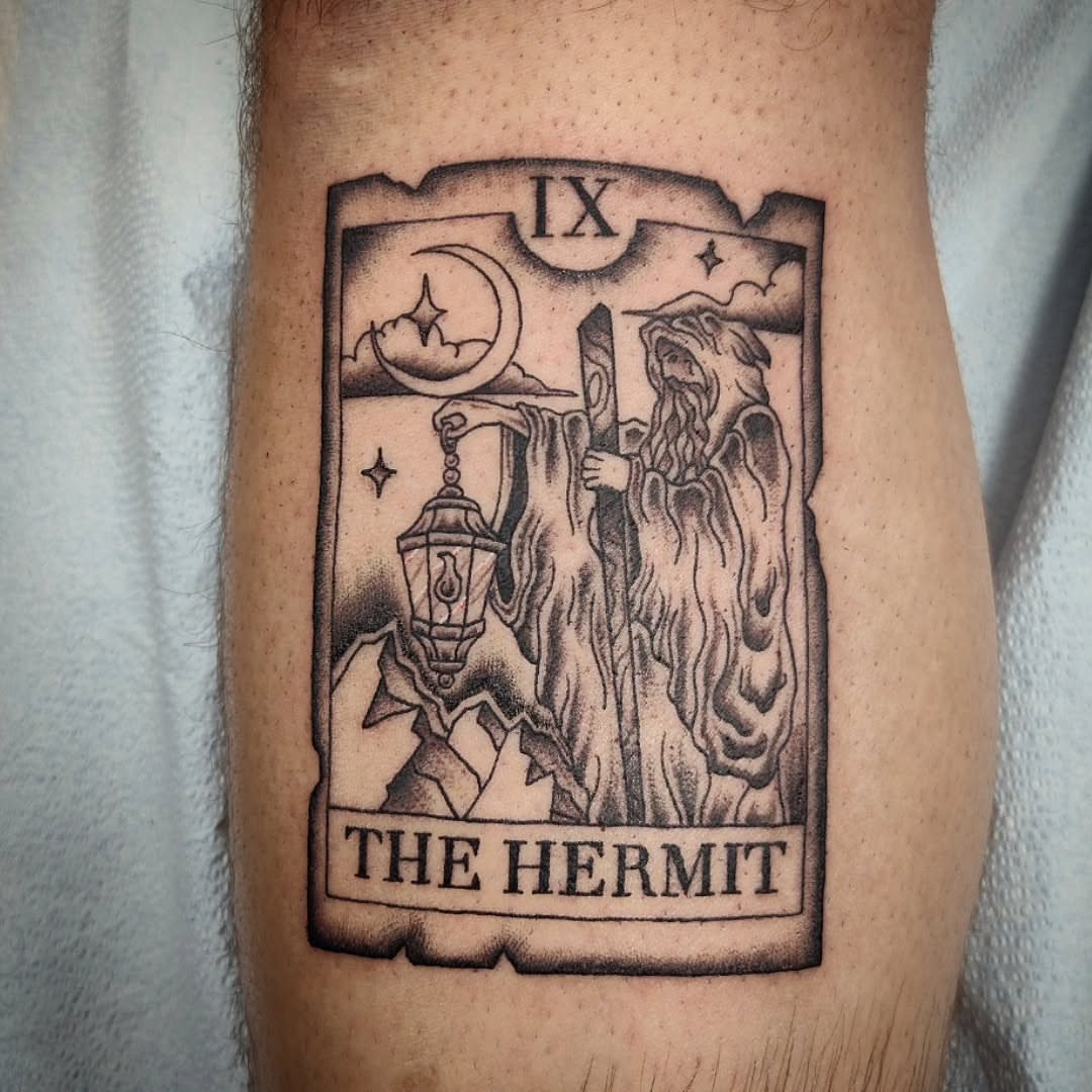 The hermit tarot card black and grey tattoo on the forearm by Julie MacDonald
