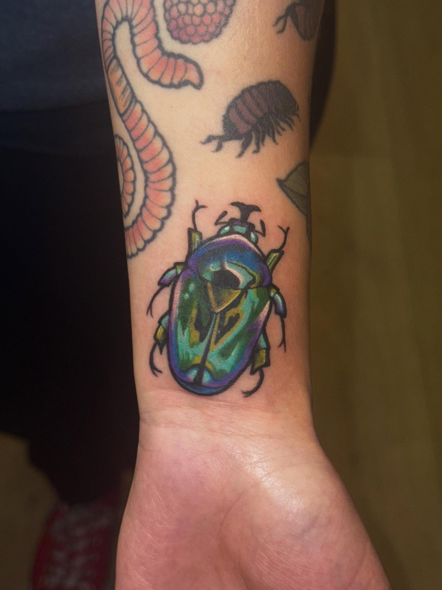 Beetle new school tattoo on the forearm by Laurito