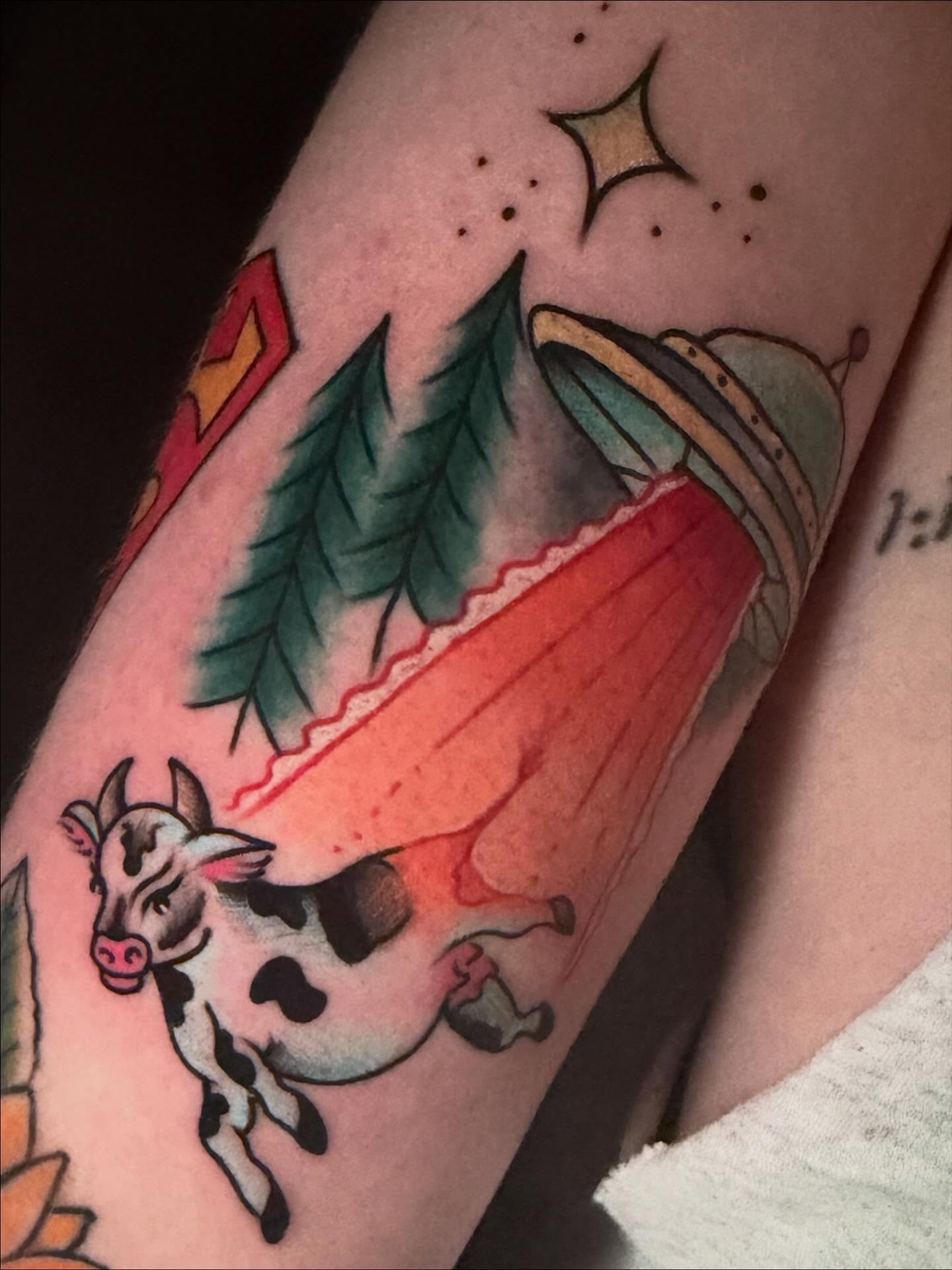 Cow and tent American traditional tattoo on the forearm by Madilynn Klassen