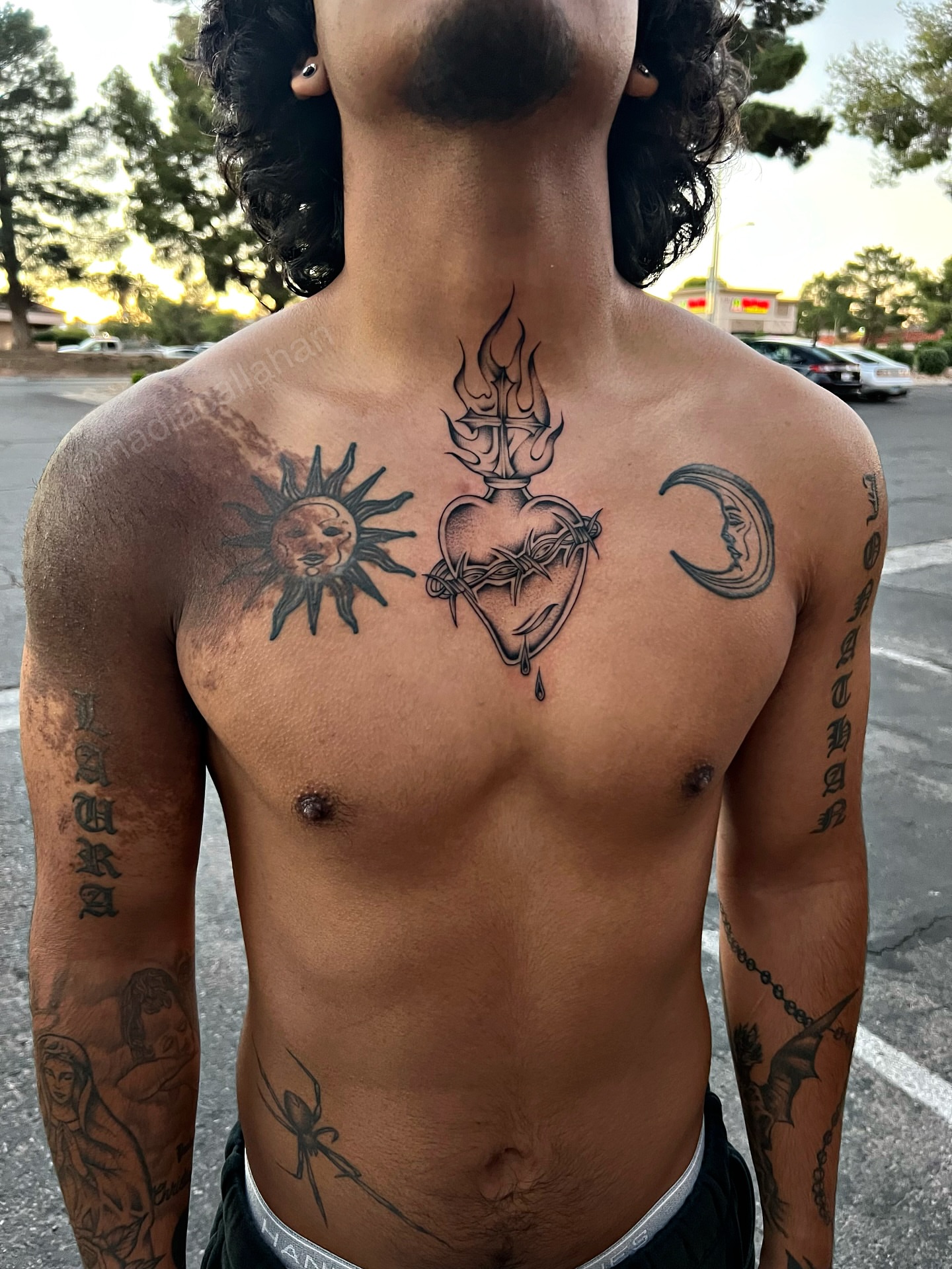 Heart with flame black and grey tattoo on the chest by Nadia ★