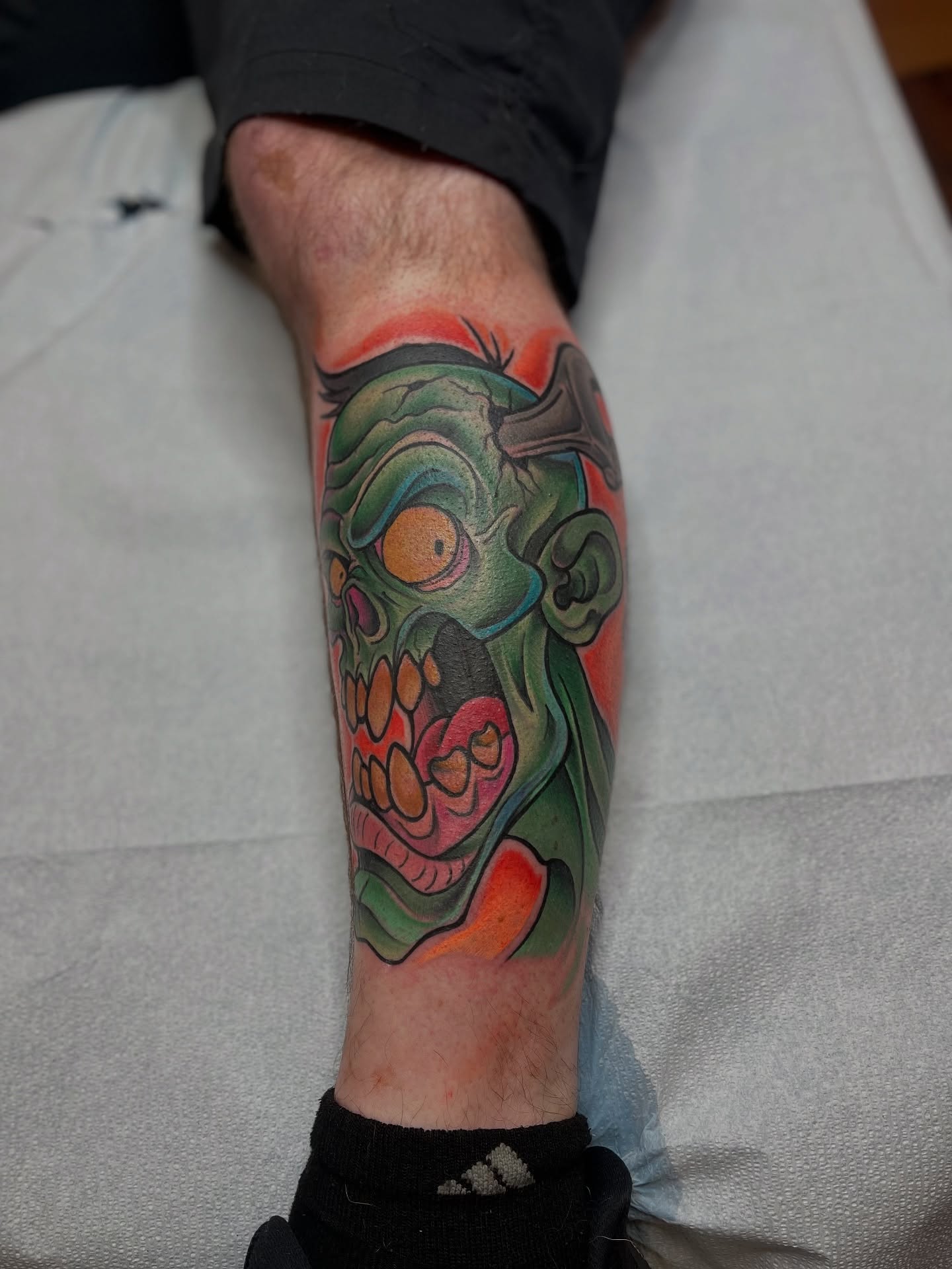Zombie head American traditional tattoo on the forearm by Fizzy Jizzles, Worcester, England